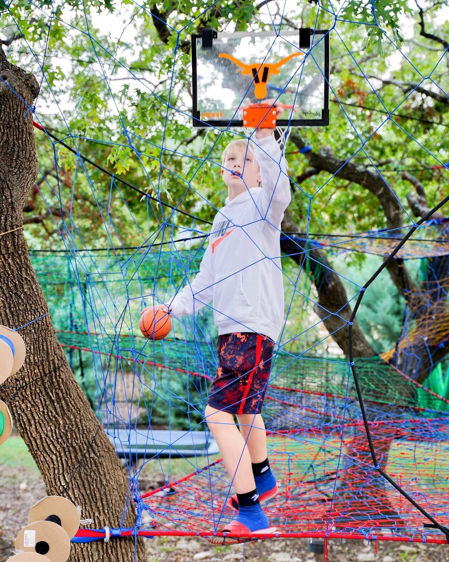 In Austin, one our clients brought out this #longhorns basketball hoop so the kids could practice their shots on the net. We all thought it was a brilliant idea. This particular #basketballhoop has hooks on it so they can move it all around the net t