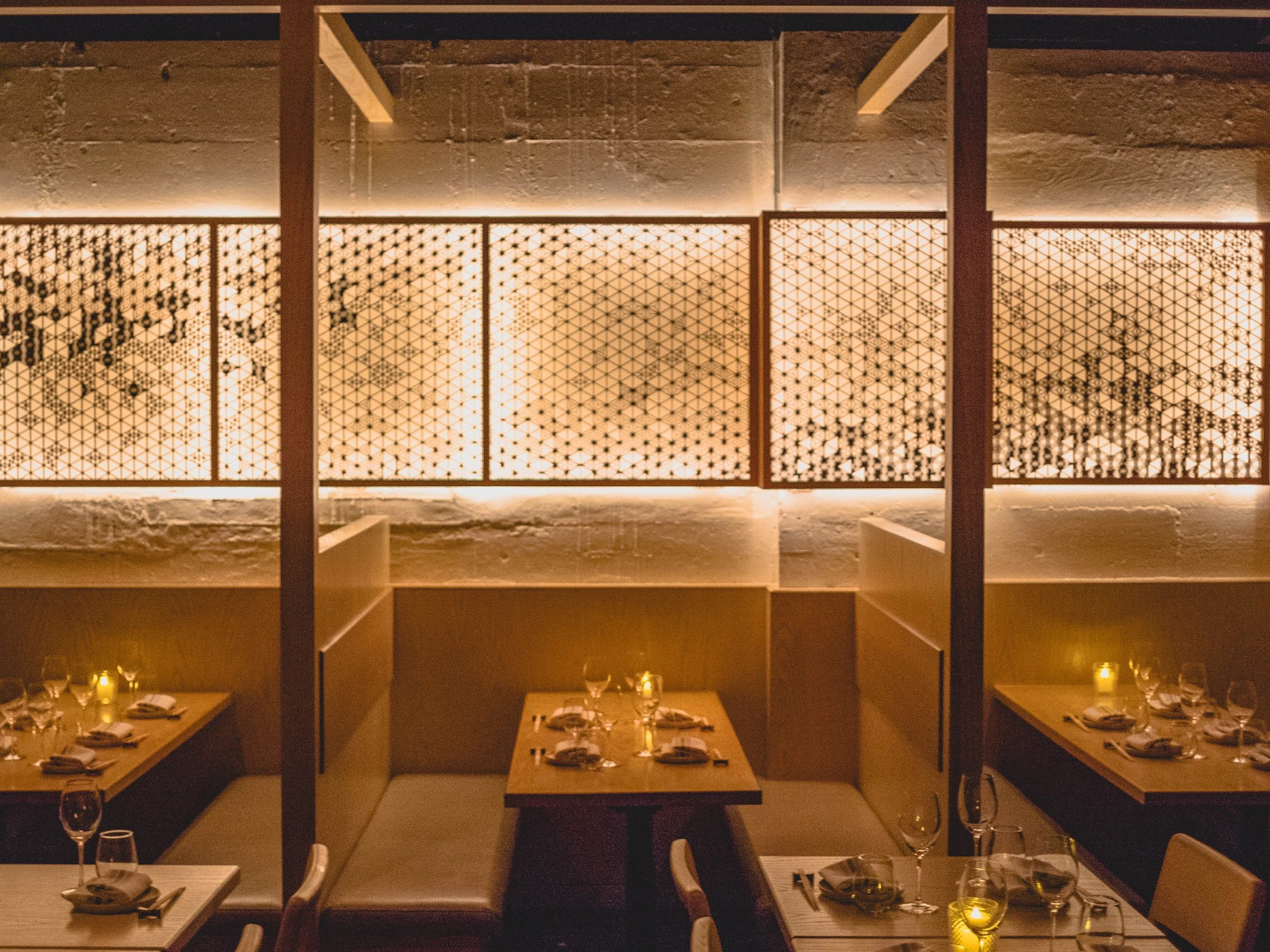 Cozy booth interior of Sakagura, top Japanese Restaurants in NYC, with warm lighting and traditional village decor in Midtown Manhattan.
