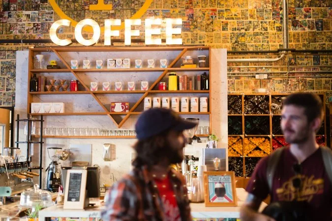 The Modern Times taproom in the Point Loma section of San Diego set aside a section for coffee. It opens at 8 a.m. daily and sells flights of cold-brew and pour-over coffee made with beans that it ages in rum barrels. Credit: Tara Pixley for The New York Times