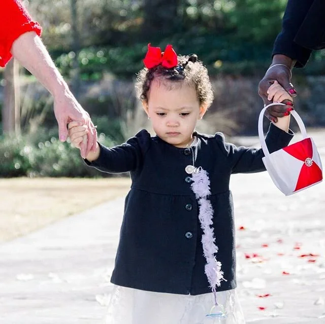 This flower girl had her hands full, escorting both her Grandma's down the aisle while also dropping a few petals along the way for mom. ❤️
