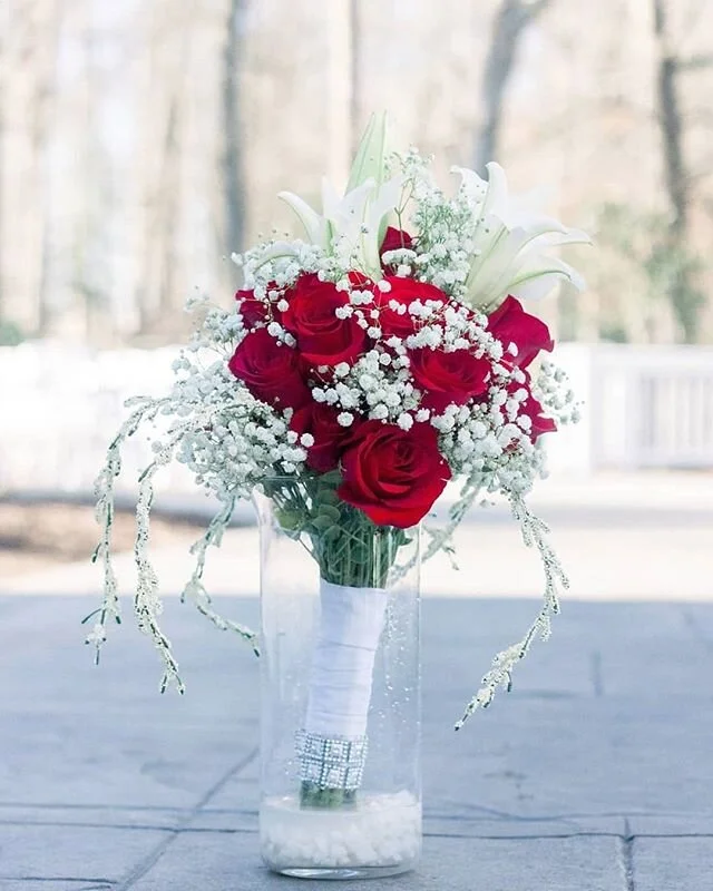 Sometimes, simplicity is key! We loved this beautiful rose bouquet that Ebony carried down the aisle on her big day. Their alter floor was covered in red and white rose petals that set that color scheme of this wedding OFF! Great choice Ebony &amp; M