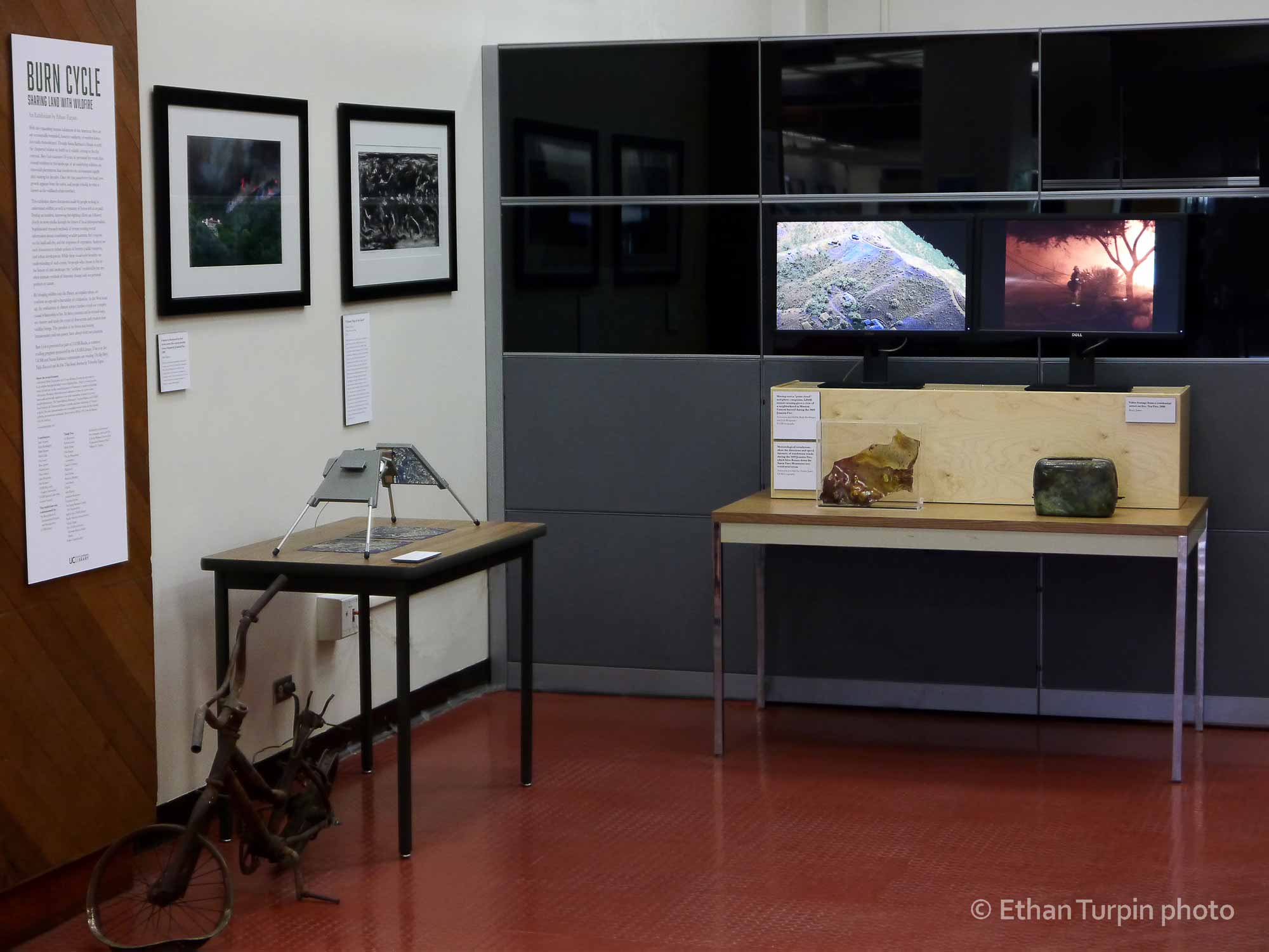 Data animations, news video, climate mapping, and found possessions were seen alongside each other in the first Burn Cycle exhibit. Visual information giving broad perspective at global and mountain scale was made personal in the context of intimate household objects, like a toaster and melted glassware.