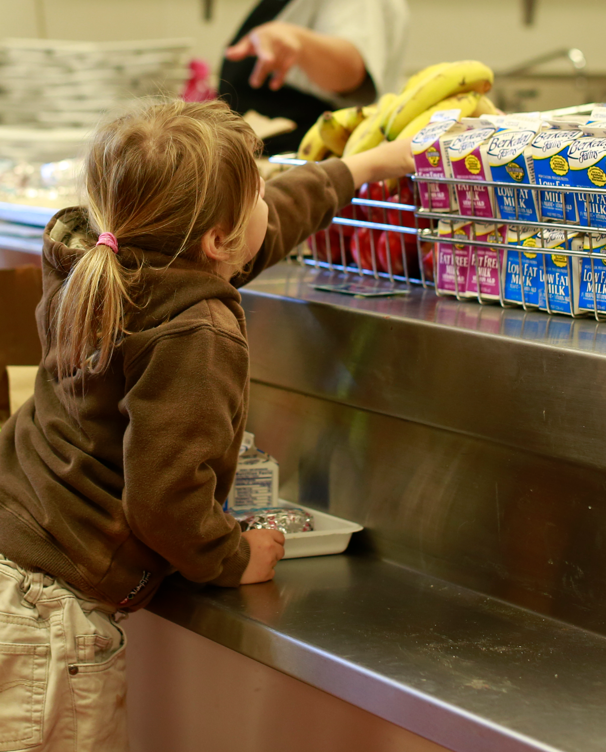 Student Reaching for Fruit in line (1).png