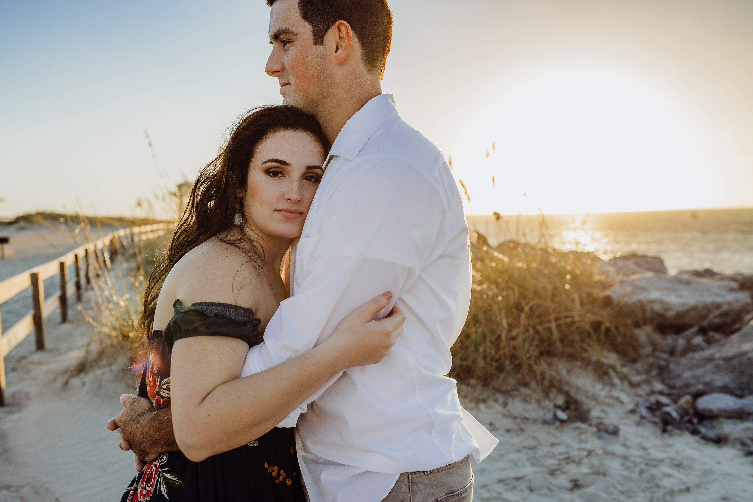 Daytona Beach engagement photographer shot in Ponce Inlet, Fl styled with a floral Sophie and Trey maxi dress