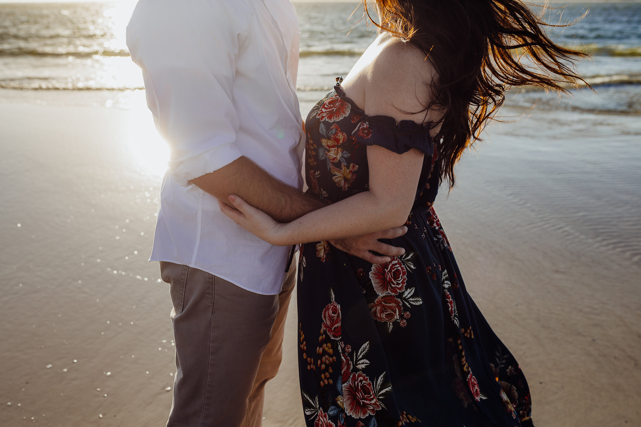 Daytona Beach engagement photographer shot in Ponce Inlet, Fl styled with a floral Sophie and Trey maxi dress