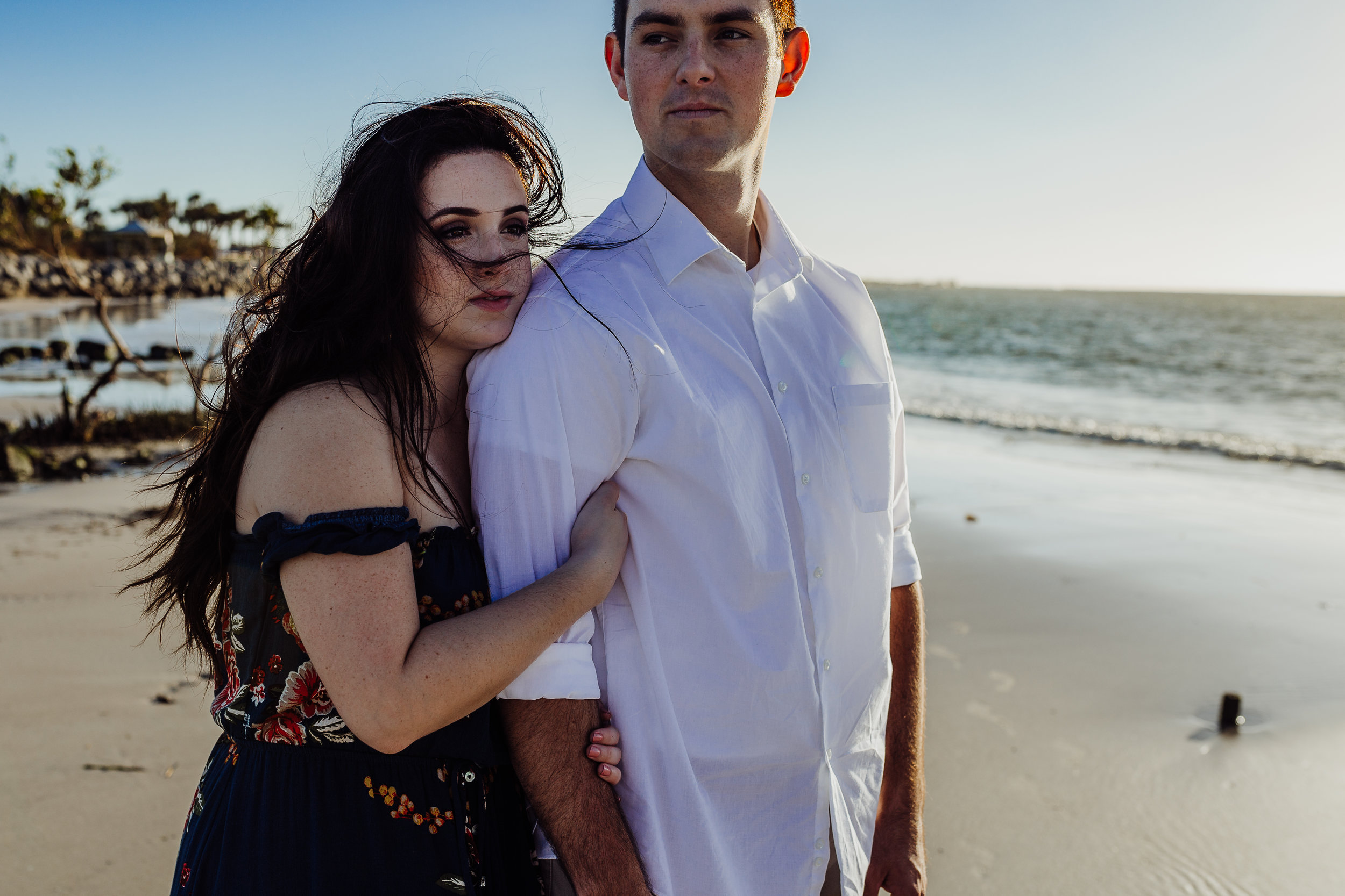 Daytona Beach engagement photographer shot in Ponce Inlet, Fl styled with a floral Sophie and Trey maxi dress