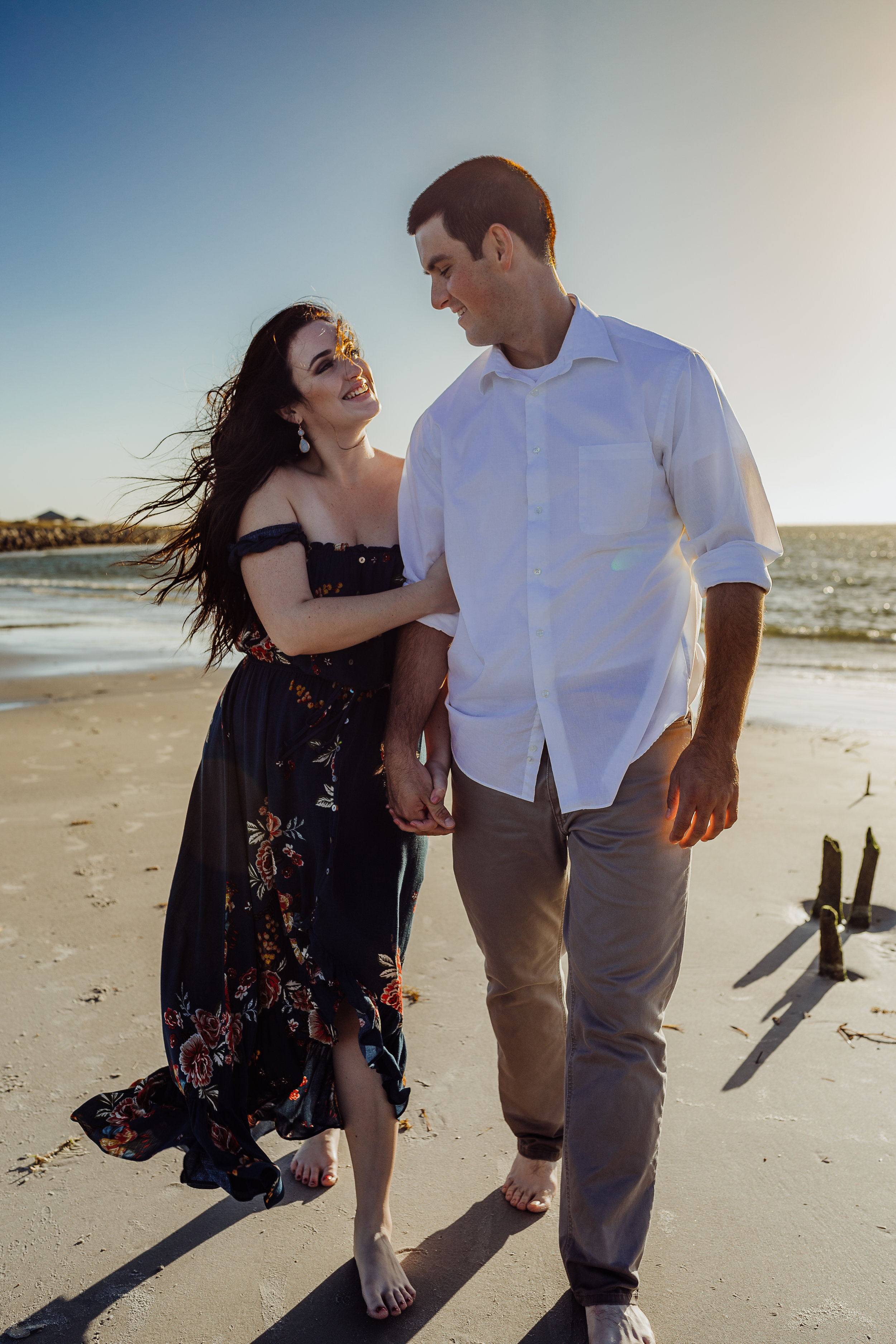 Daytona Beach engagement photographer shot in Ponce Inlet, Fl styled with a floral Sophie and Trey maxi dress