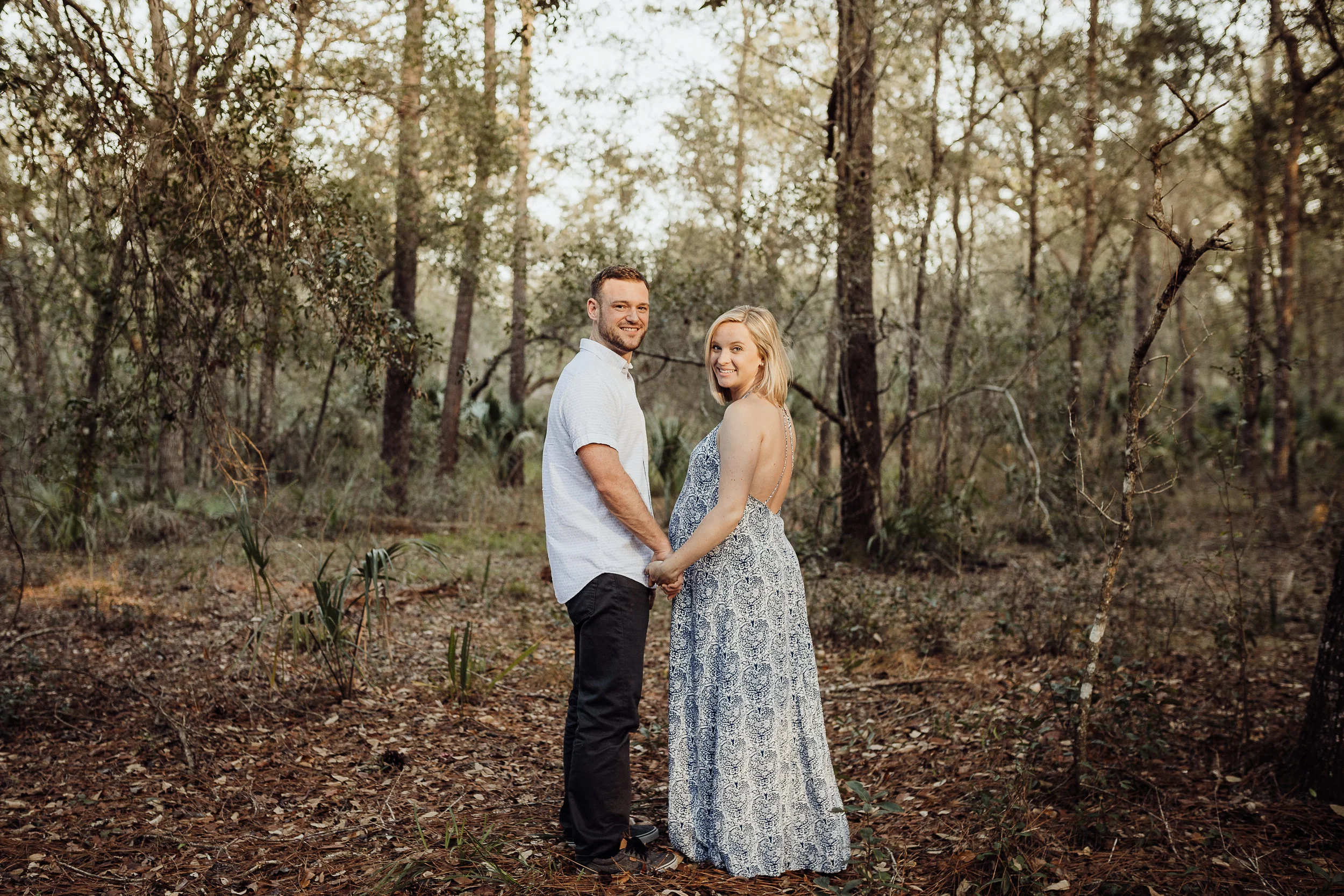 Orlando Maternity Photographer with session location at Kelly Spring park with a boho maxi dress