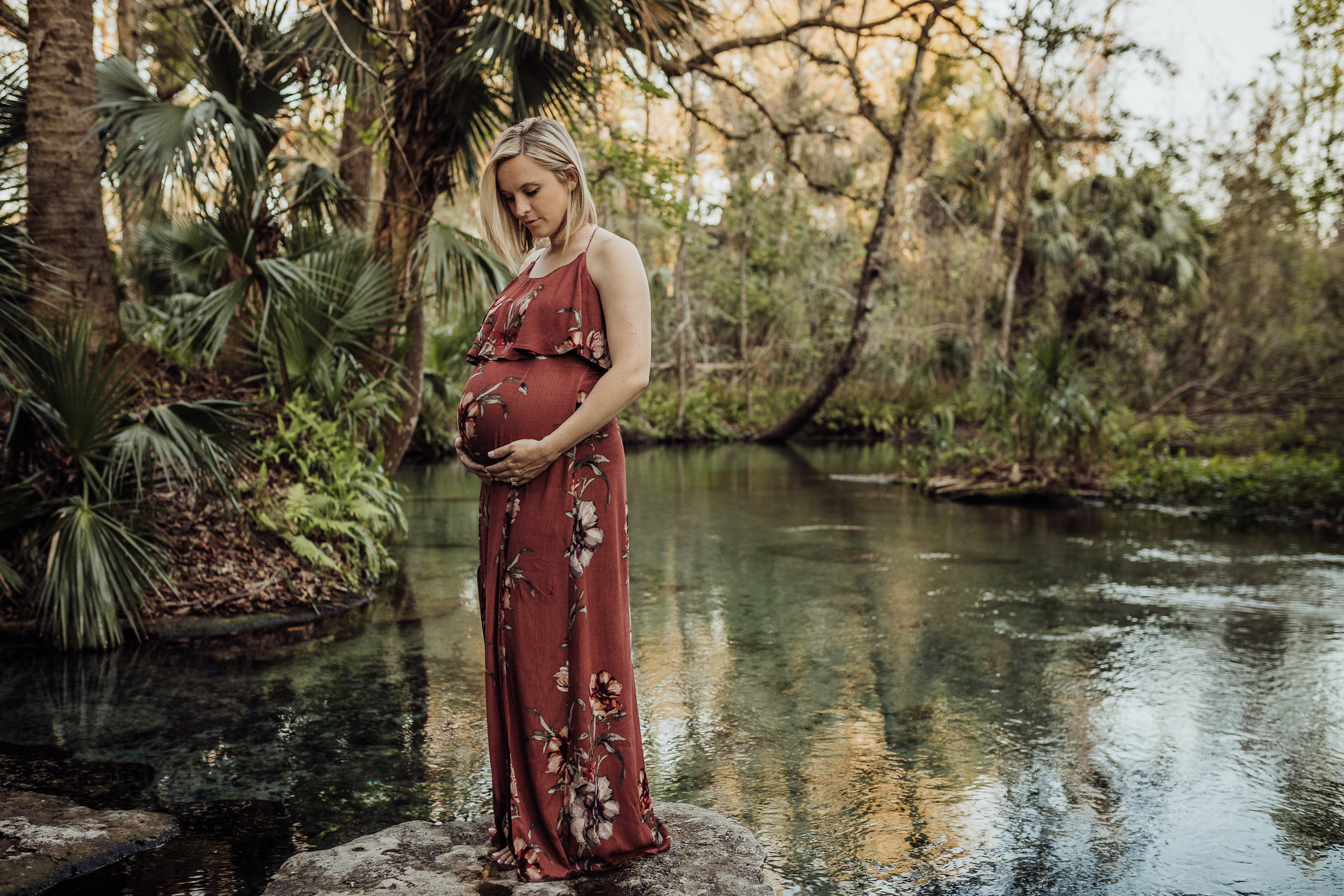 Orlando Maternity Photographer with session location at Kelly Spring park with a boho maxi dress