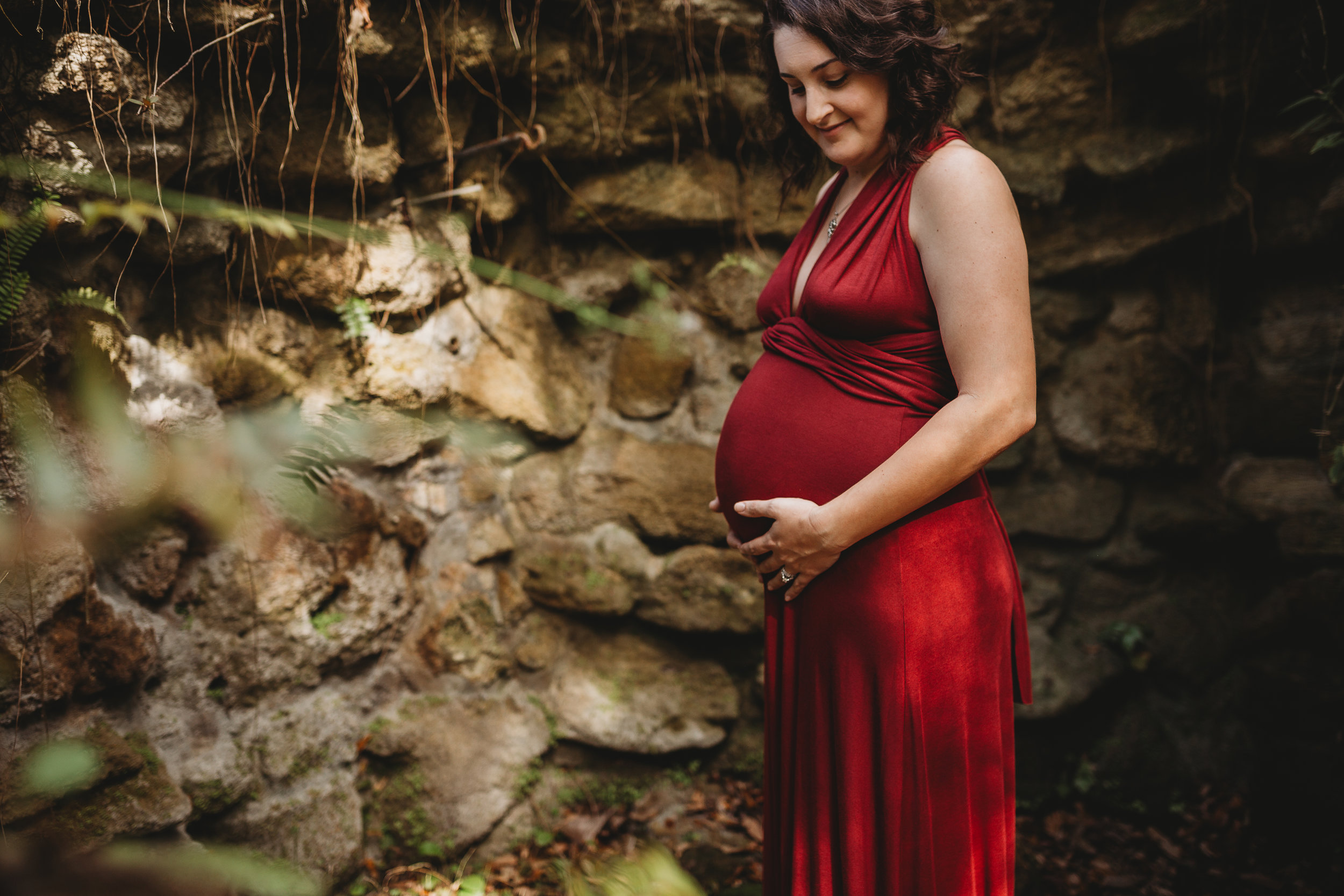 Daytona Beach Maternity photographer capturing emotive images at Sugar Mill Gardens in Port Orange