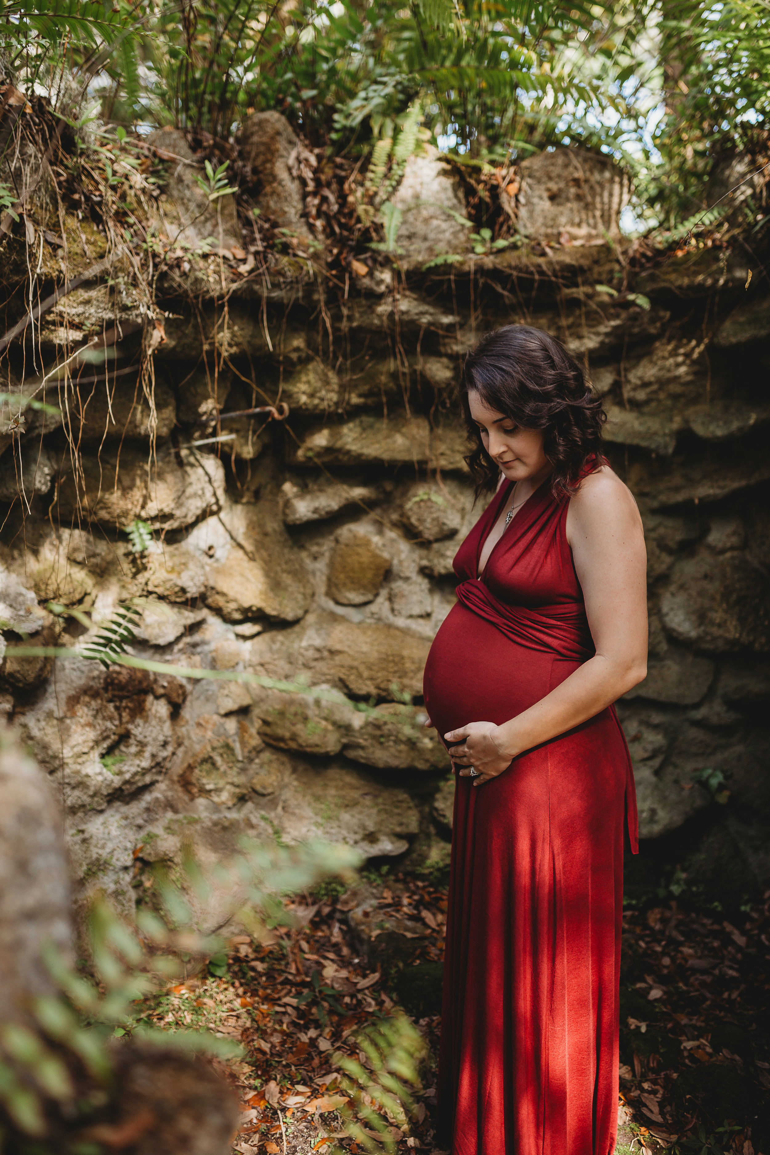 Daytona Beach Maternity photographer capturing emotive images at Sugar Mill Gardens in Port Orange