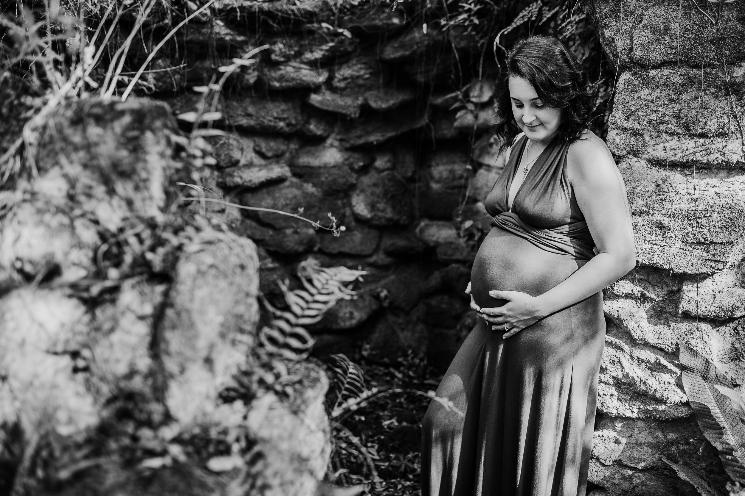 Daytona Beach Maternity photographer capturing emotive images at Sugar Mill Gardens in Port Orange