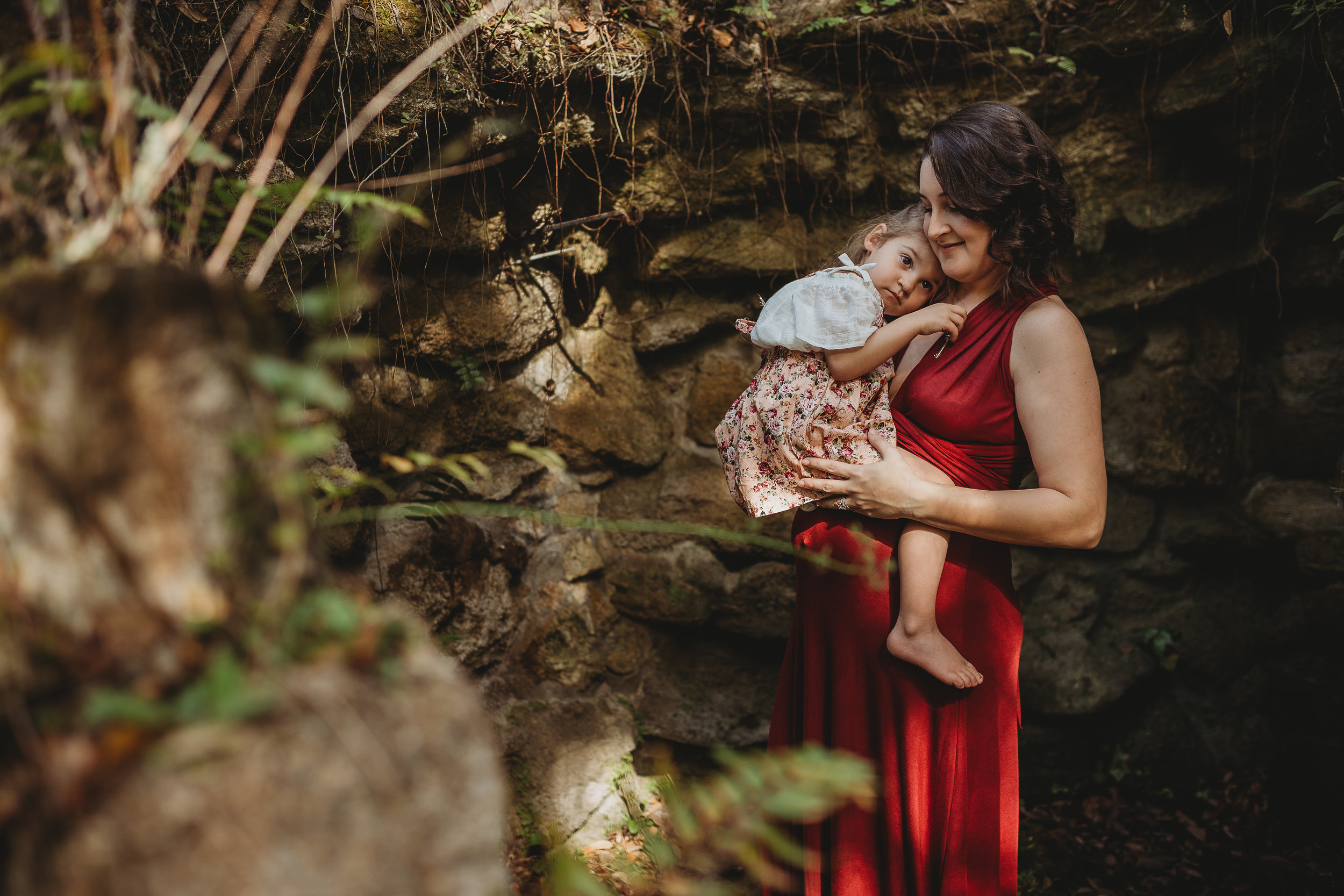 Daytona Beach Maternity photographer capturing emotive images at Sugar Mill Gardens in Port Orange