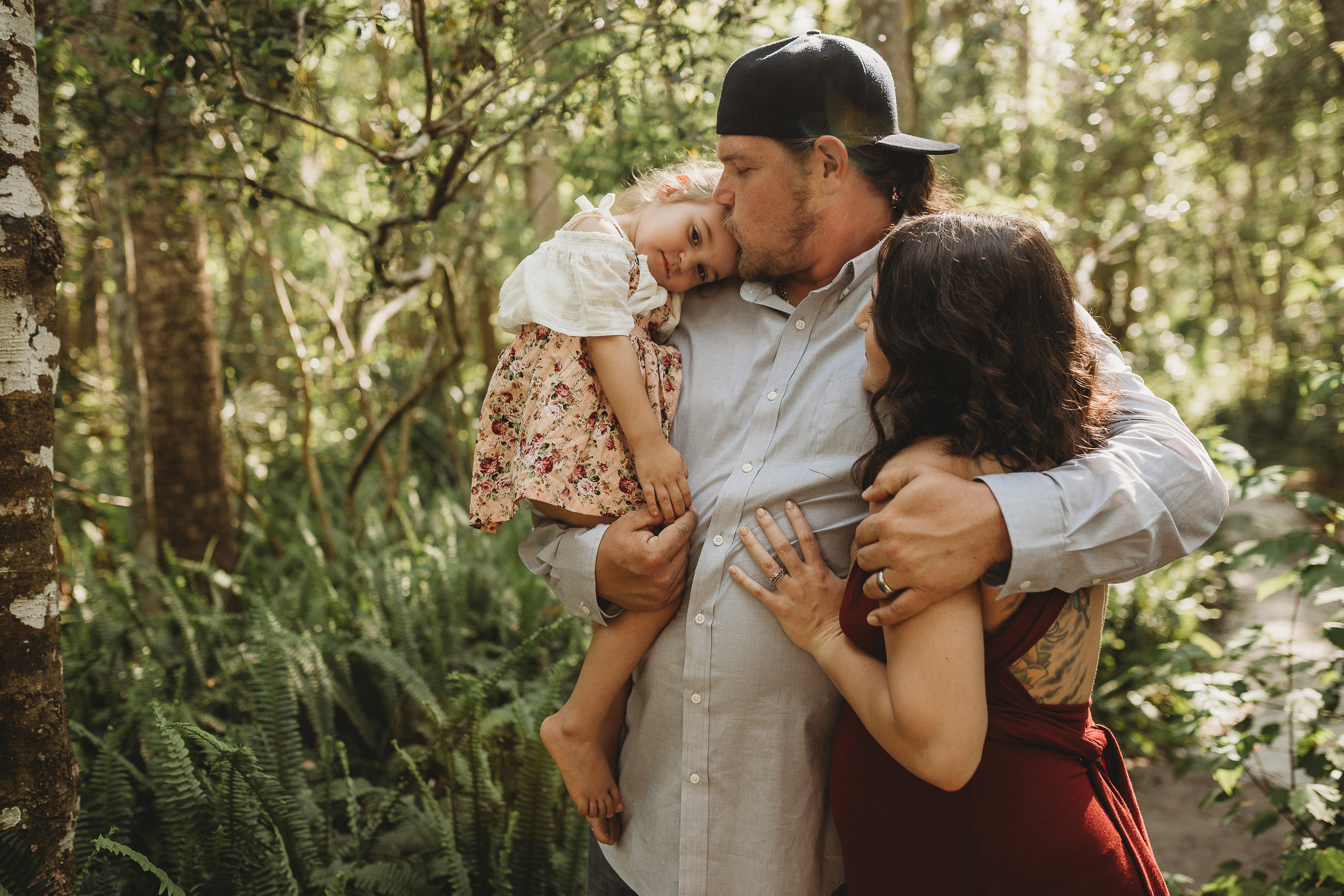 Daytona Beach Maternity photographer capturing emotive images at Sugar Mill Gardens in Port Orange