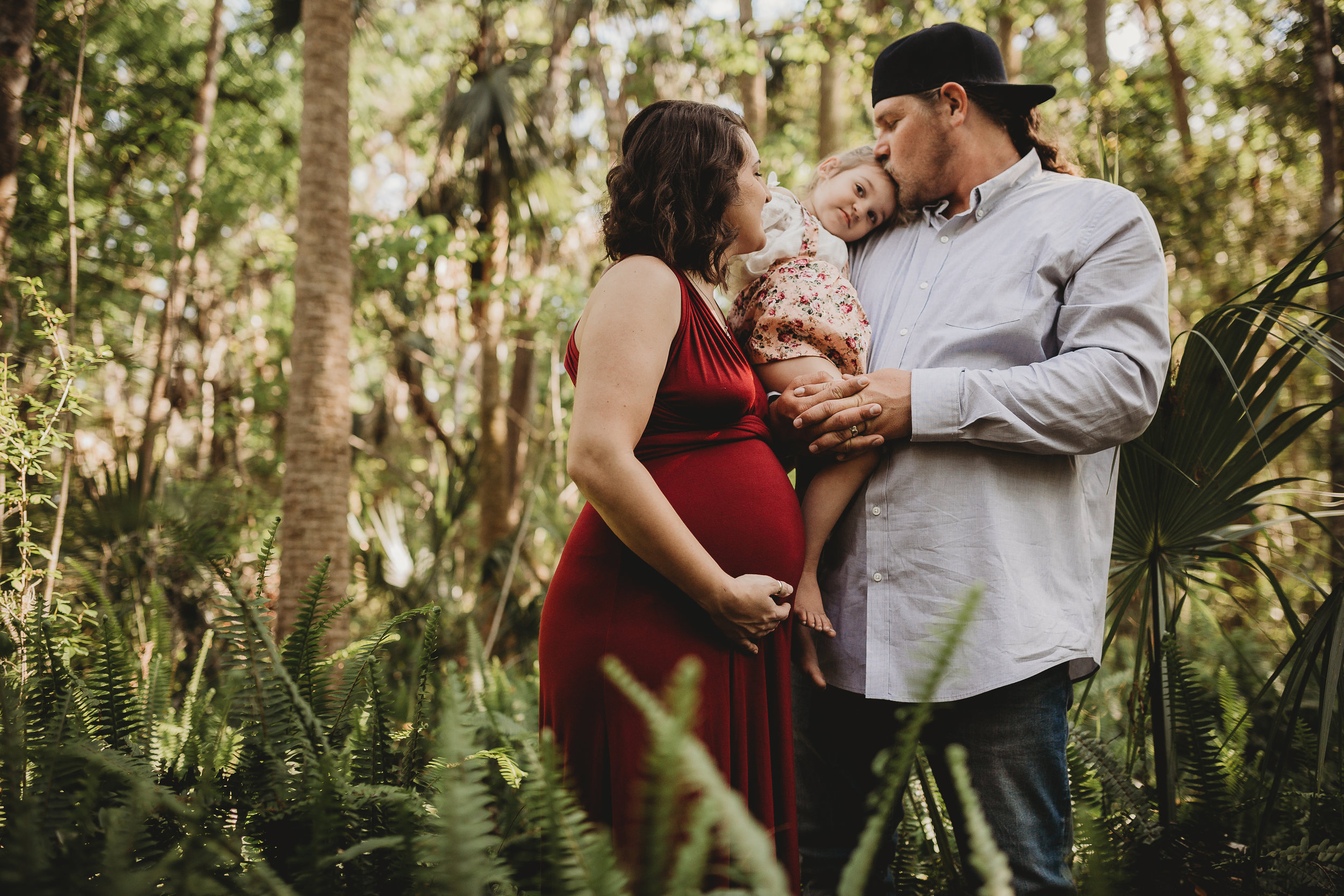 Daytona Beach Maternity photographer capturing emotive images at Sugar Mill Gardens in Port Orange