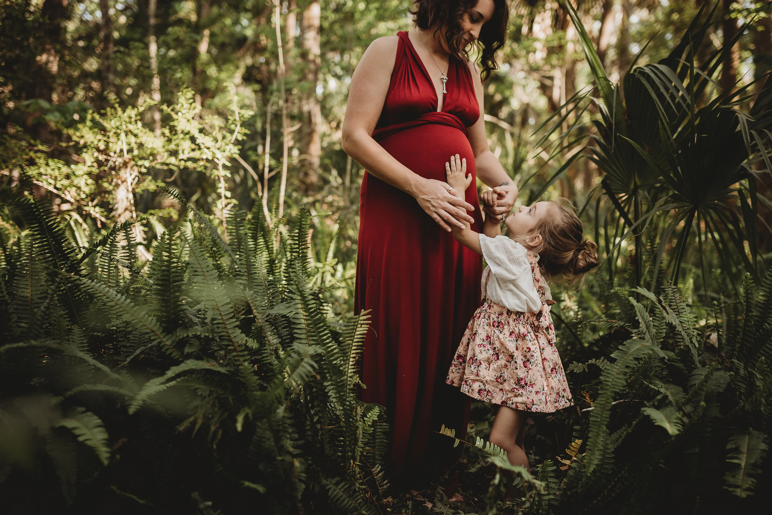Daytona Beach Maternity photographer capturing emotive images at Sugar Mill Gardens in Port Orange