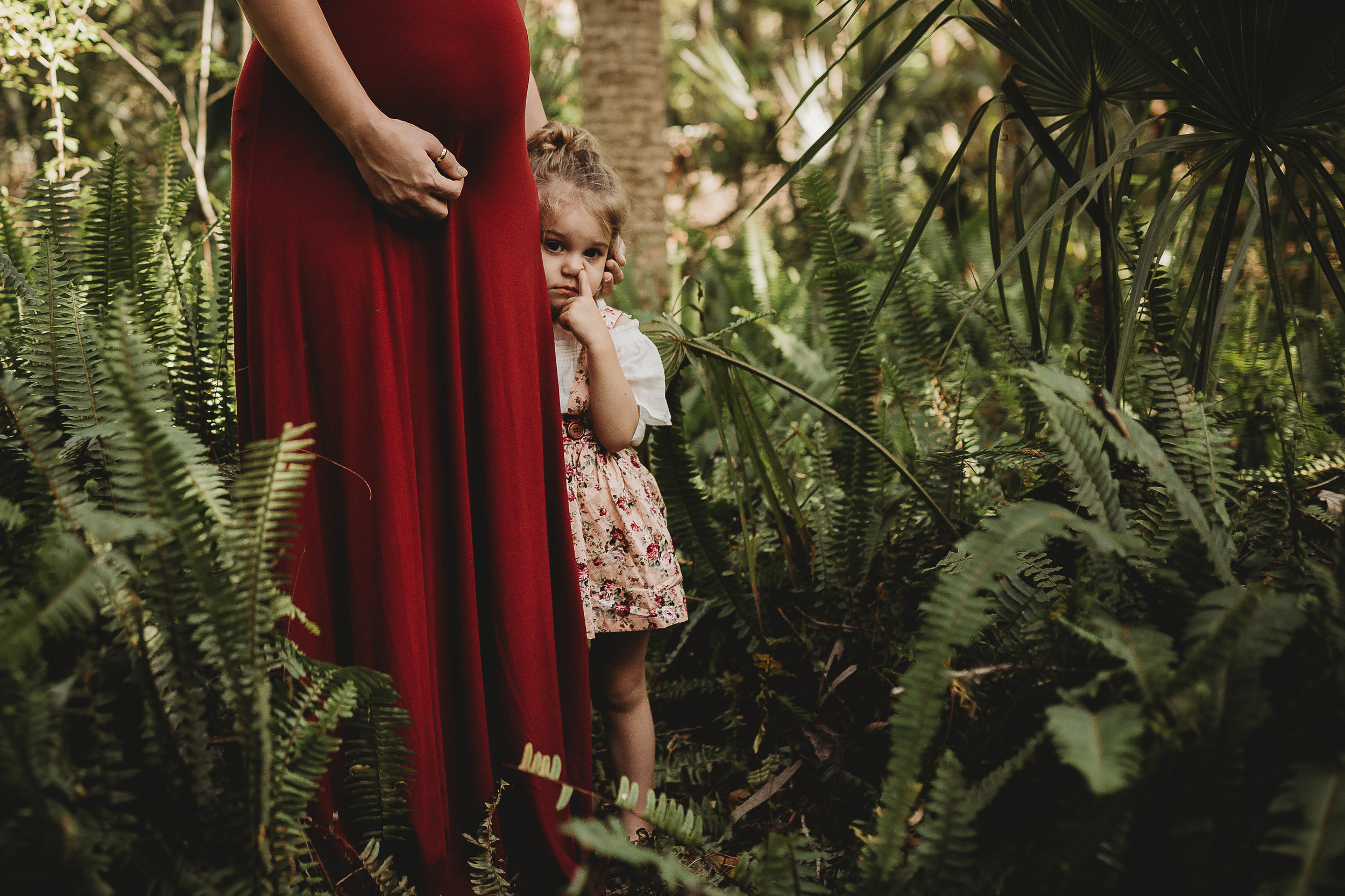 Daytona Beach Maternity photographer capturing emotive images at Sugar Mill Gardens in Port Orange