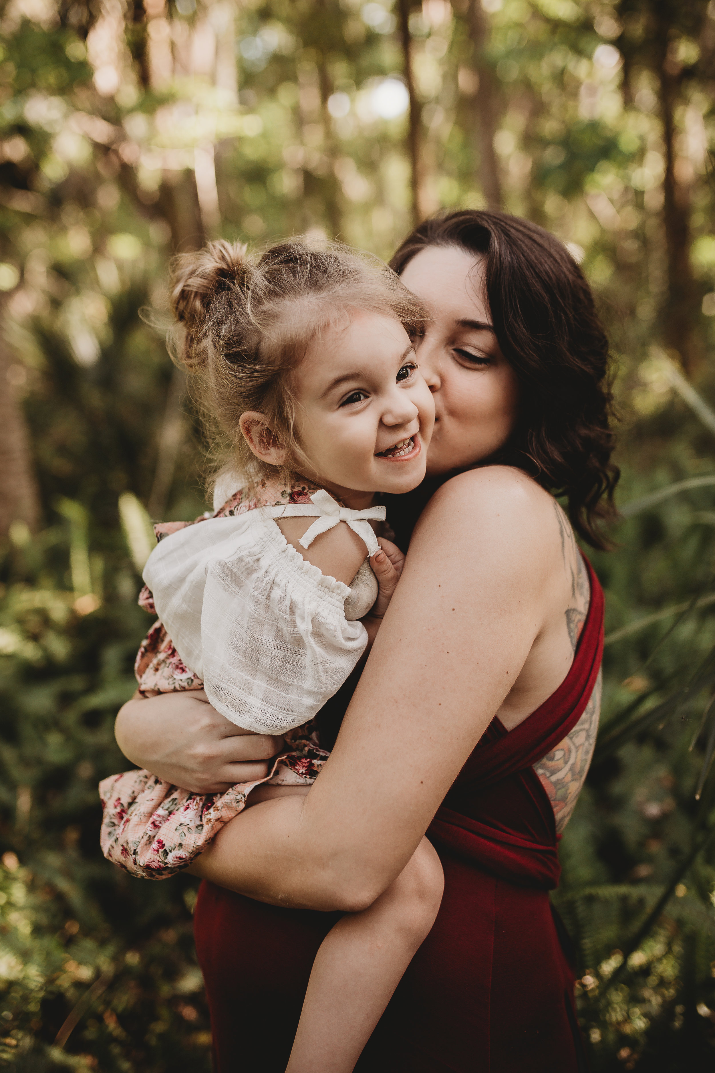 Daytona Beach Maternity photographer capturing emotive images at Sugar Mill Gardens in Port Orange