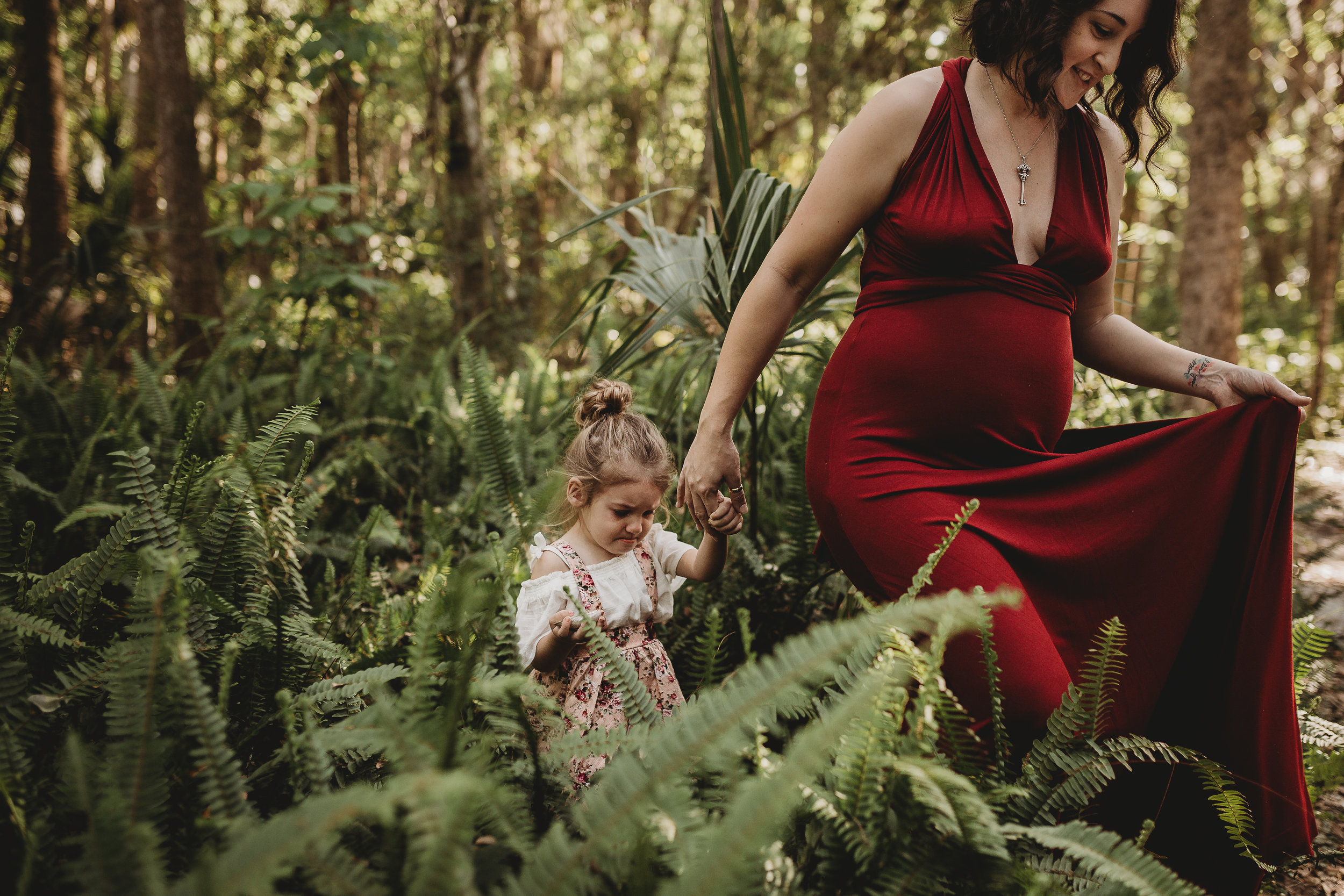 Daytona Beach Maternity photographer capturing emotive images at Sugar Mill Gardens in Port Orange