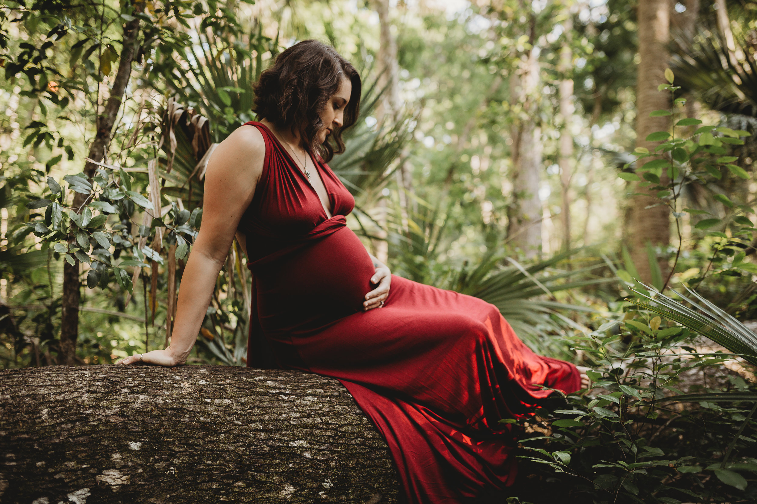 Daytona Beach Maternity photographer capturing emotive images at Sugar Mill Gardens in Port Orange