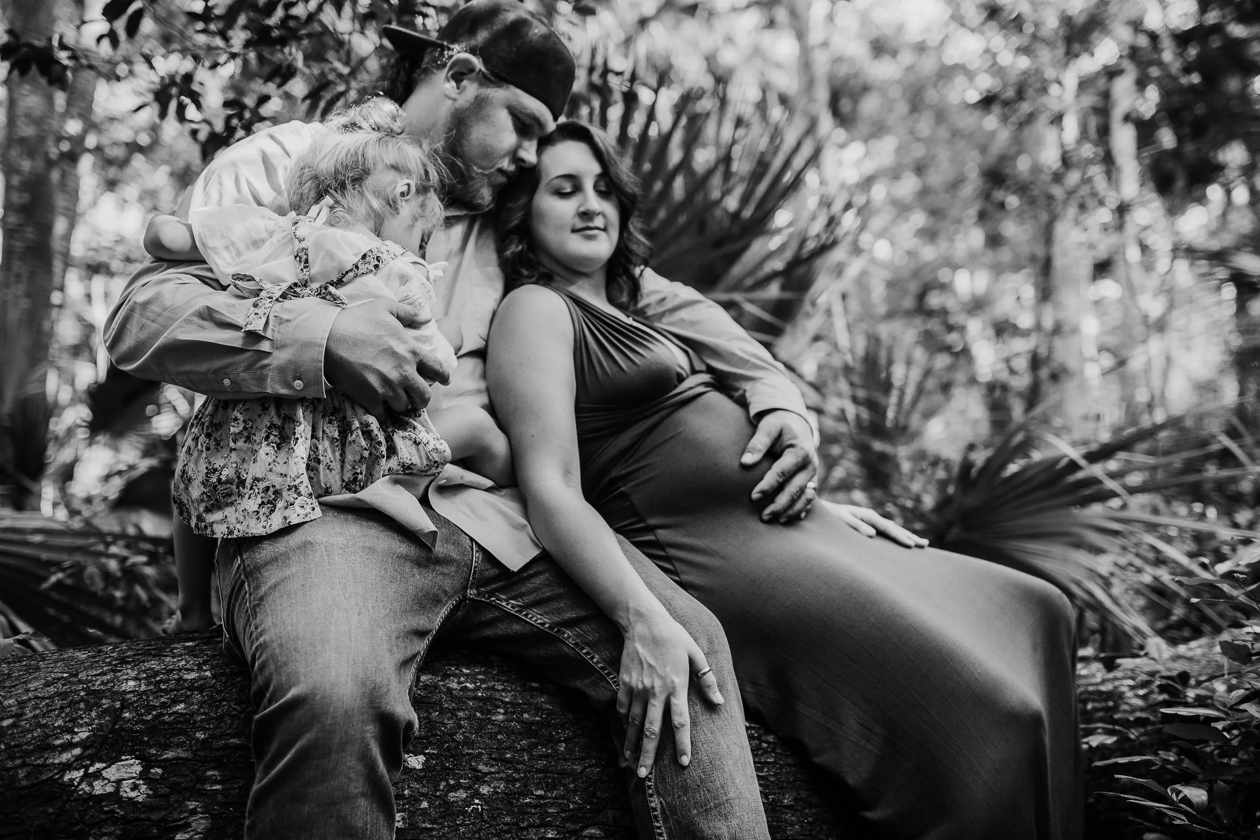 Daytona Beach Maternity photographer capturing emotive images at Sugar Mill Gardens in Port Orange