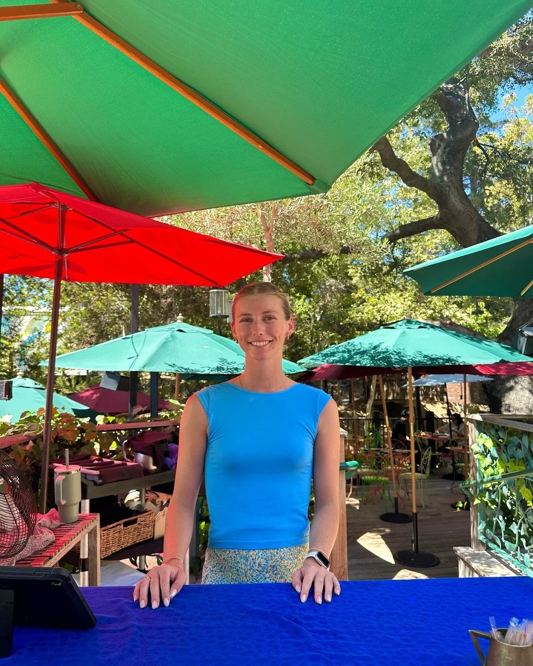 Host Sam is staying cool under the umbrellas on this warm SLO day! ☀️