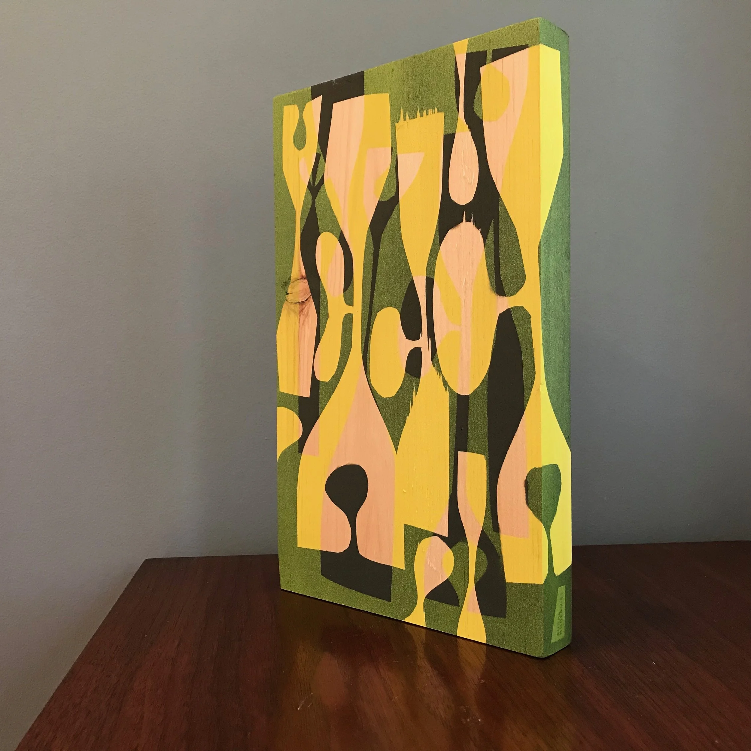 large painting with black and neon yellow shapes with wraparound edge