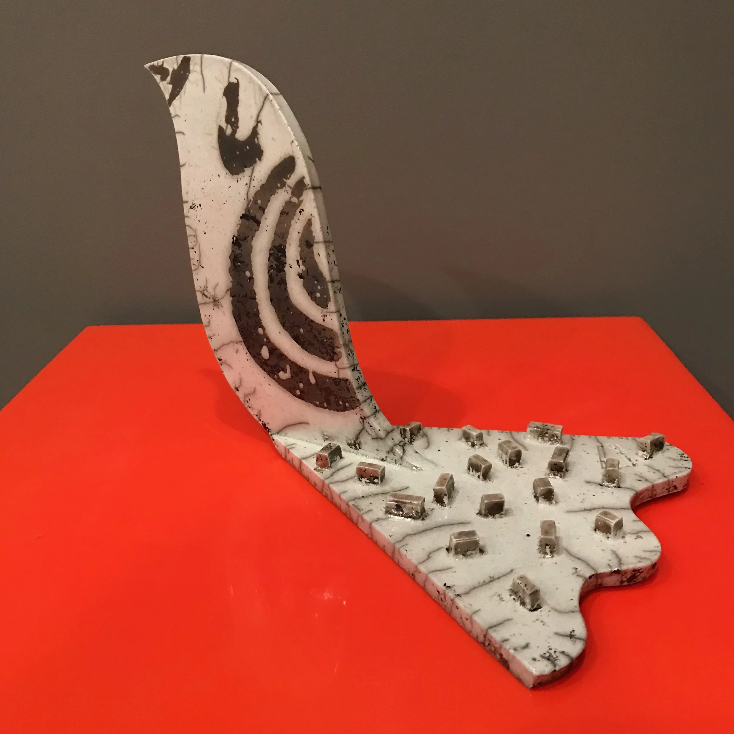 Large bird sculpture with raised confetti tail