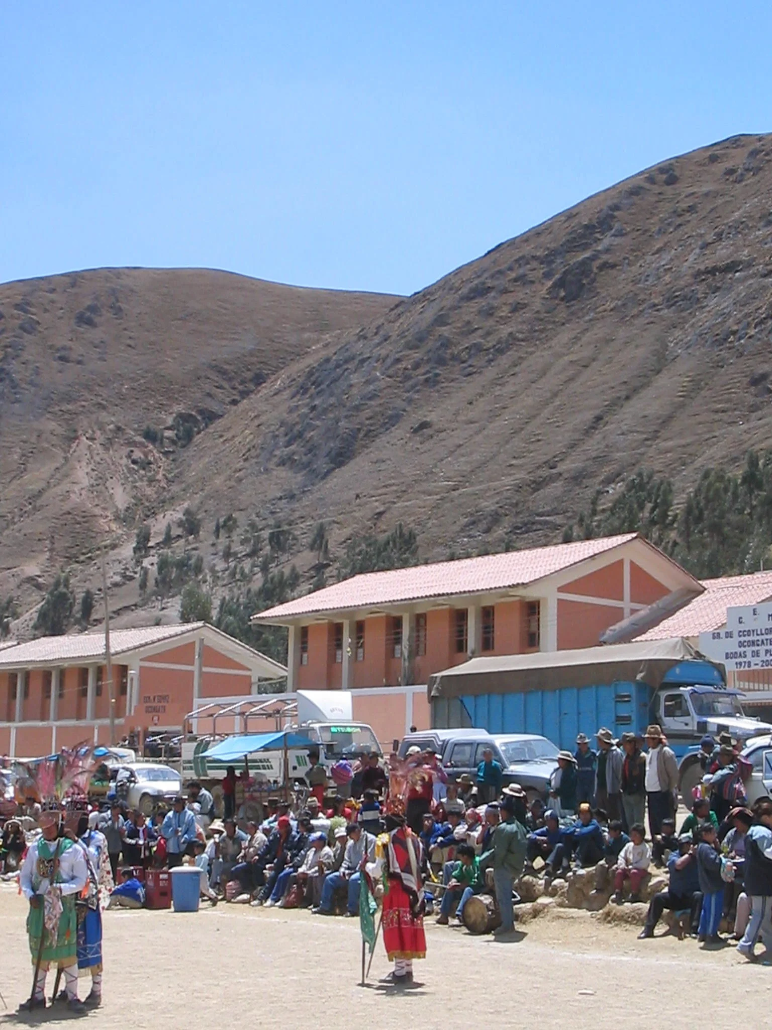 In the high Andean town of Ocongate, a dance troop of Qhapaq Ch'uncho prepares to board their truck to the Qoyllorit'i trail head further up the road. (September, 2003.)