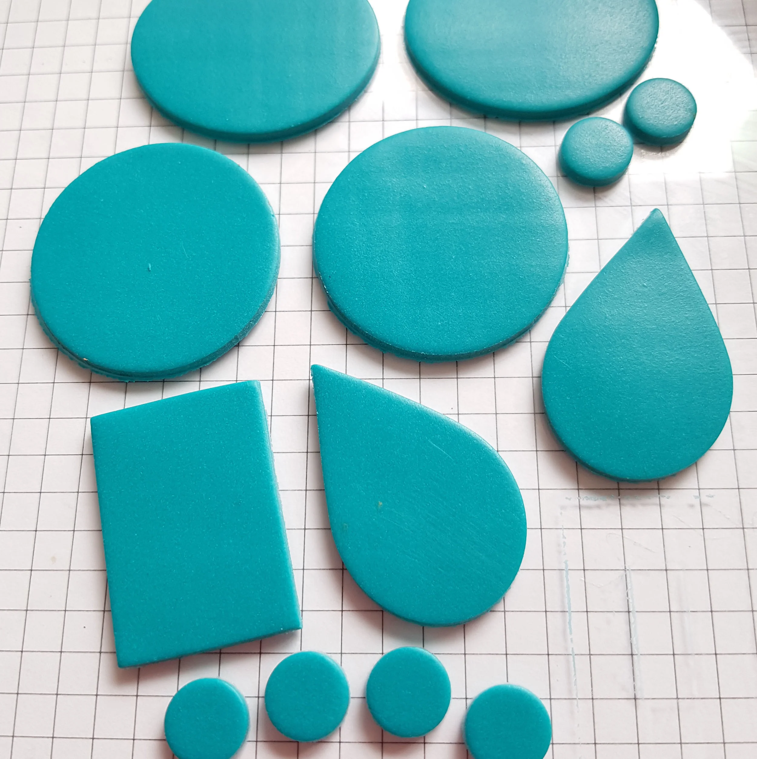 Shapes cut from the Sea Glass clay sheet, prior to curing.