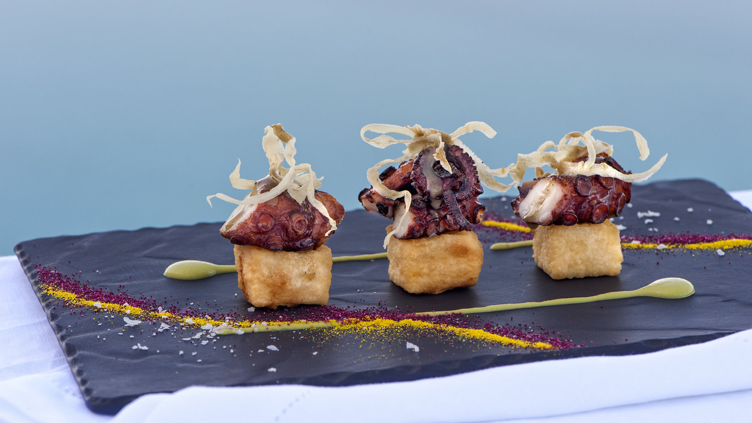Grace Santorini - Seared octopus, spring pea purée, deep fried polenta & lime truffle honey dressing