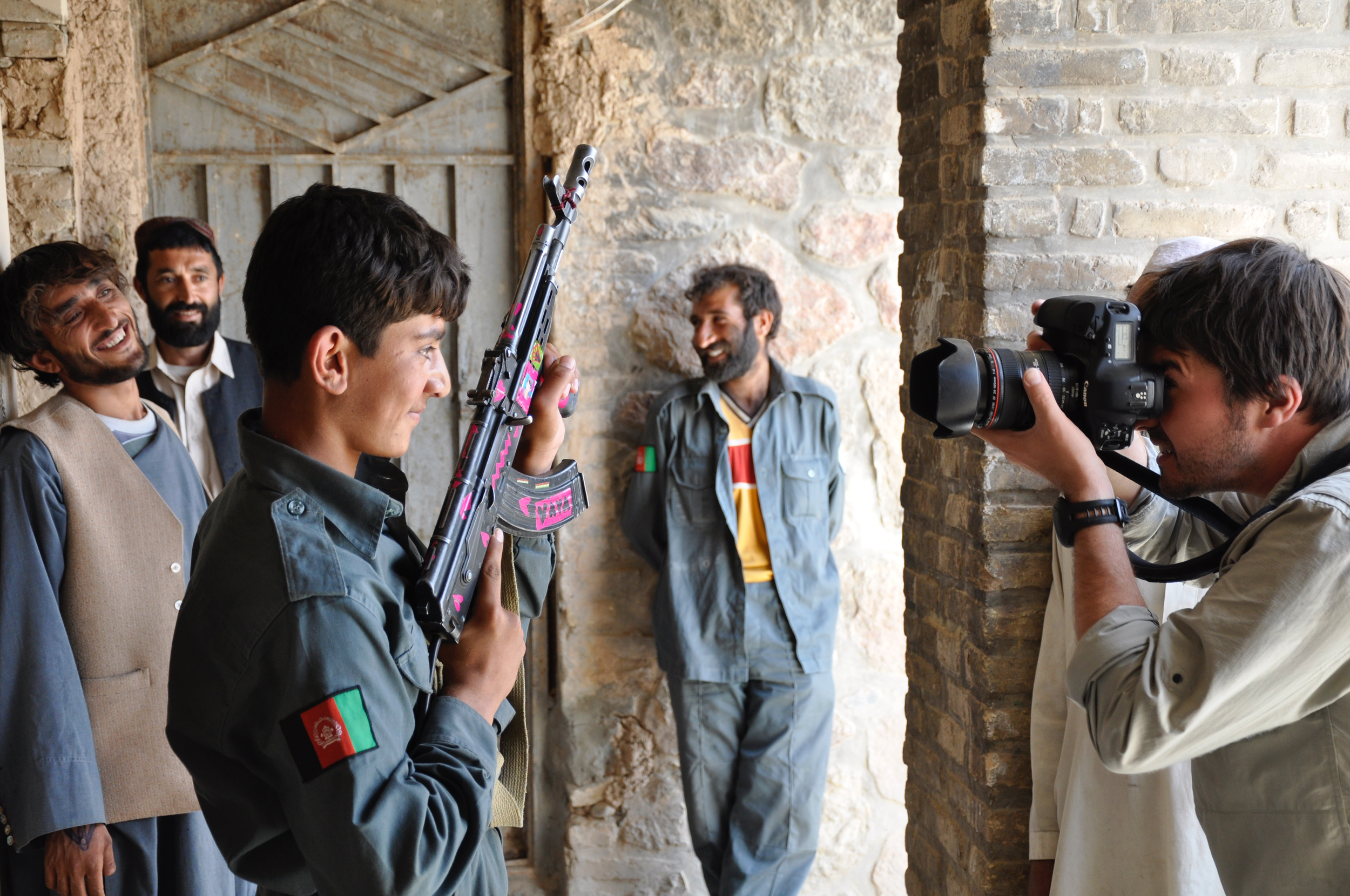 Bran Symondson, Capturing Afghan Boy Holding AK-47, 2010.png