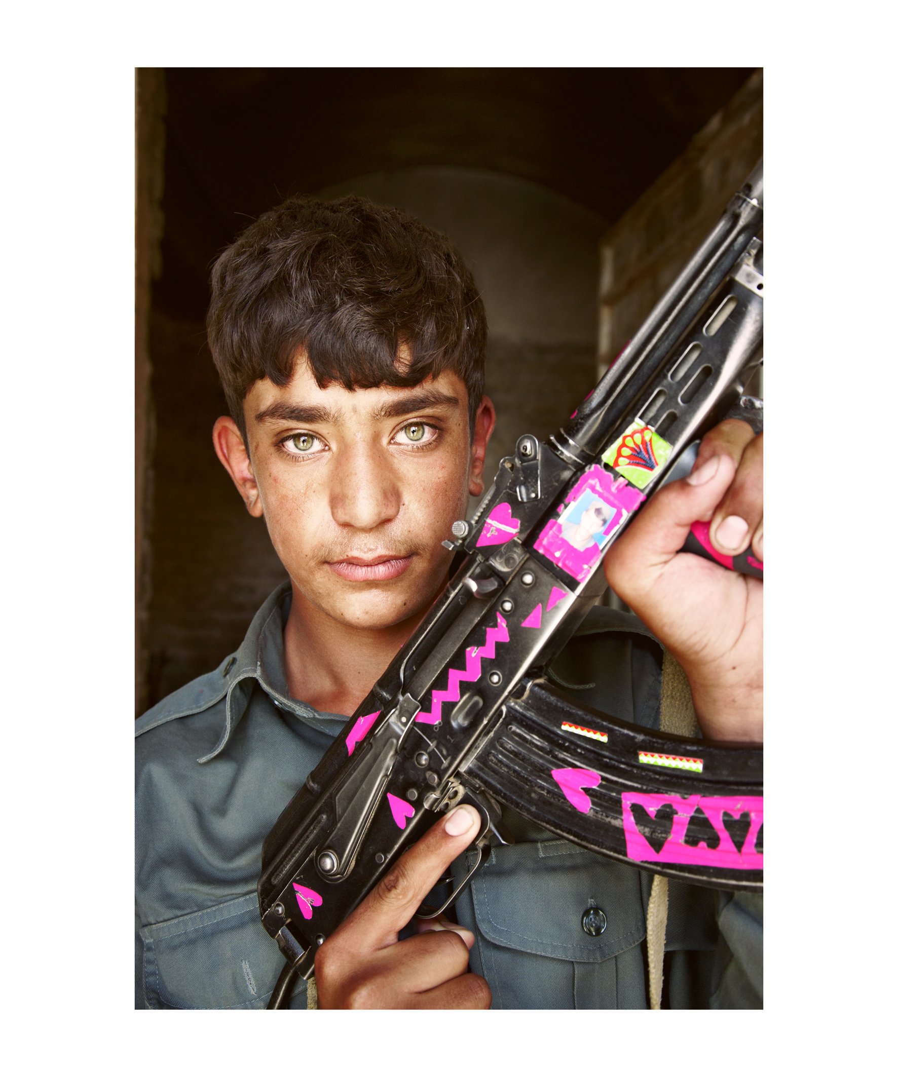 Bran Symondson, Portrait of an Afghan Boy holding a Decorated AK-47, 2010.jpg