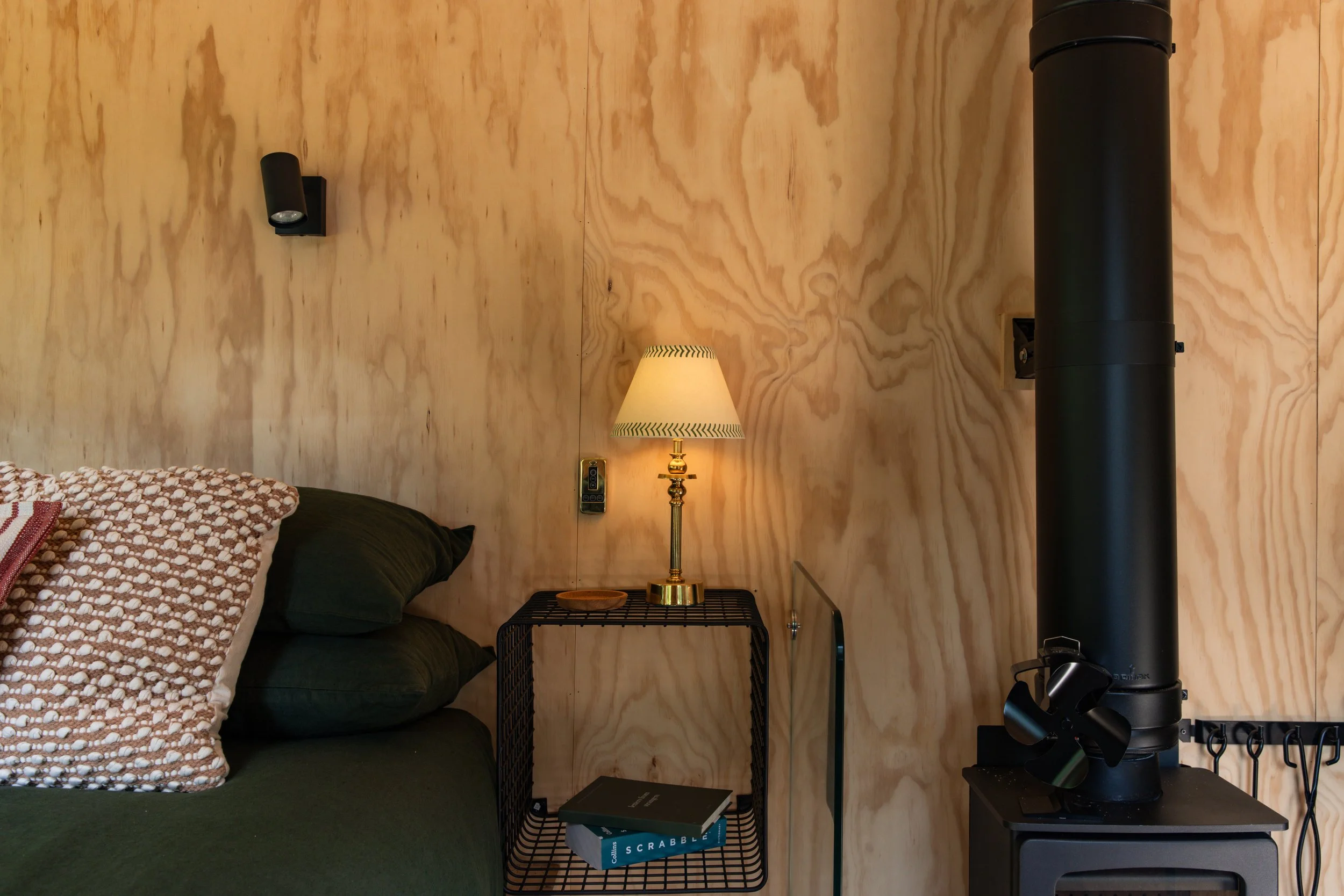 Archie_lifestyle_interior_bed_lamp_stove.jpg