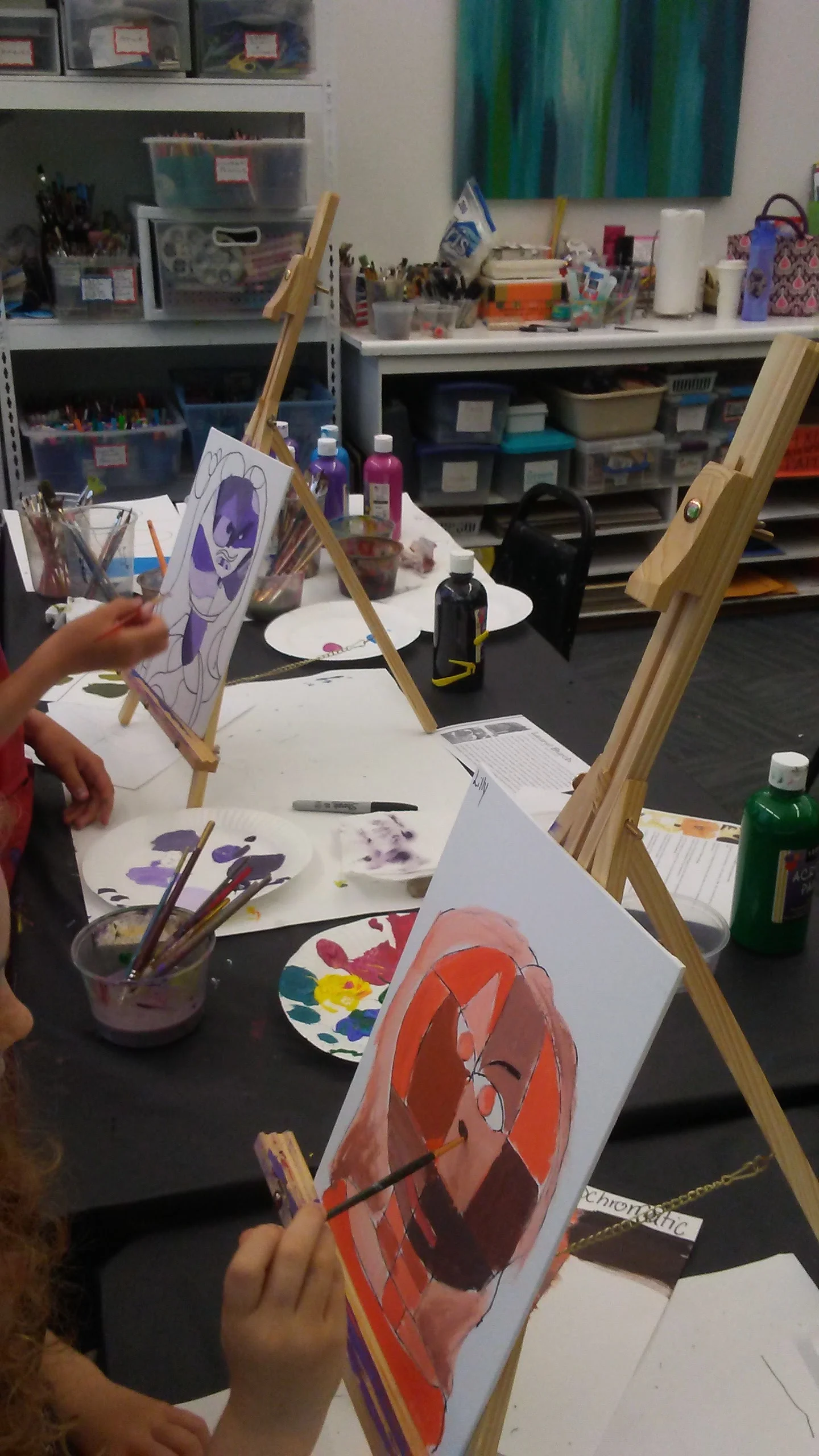 Students creating a self-portrait Klee inspired and monochromatic.