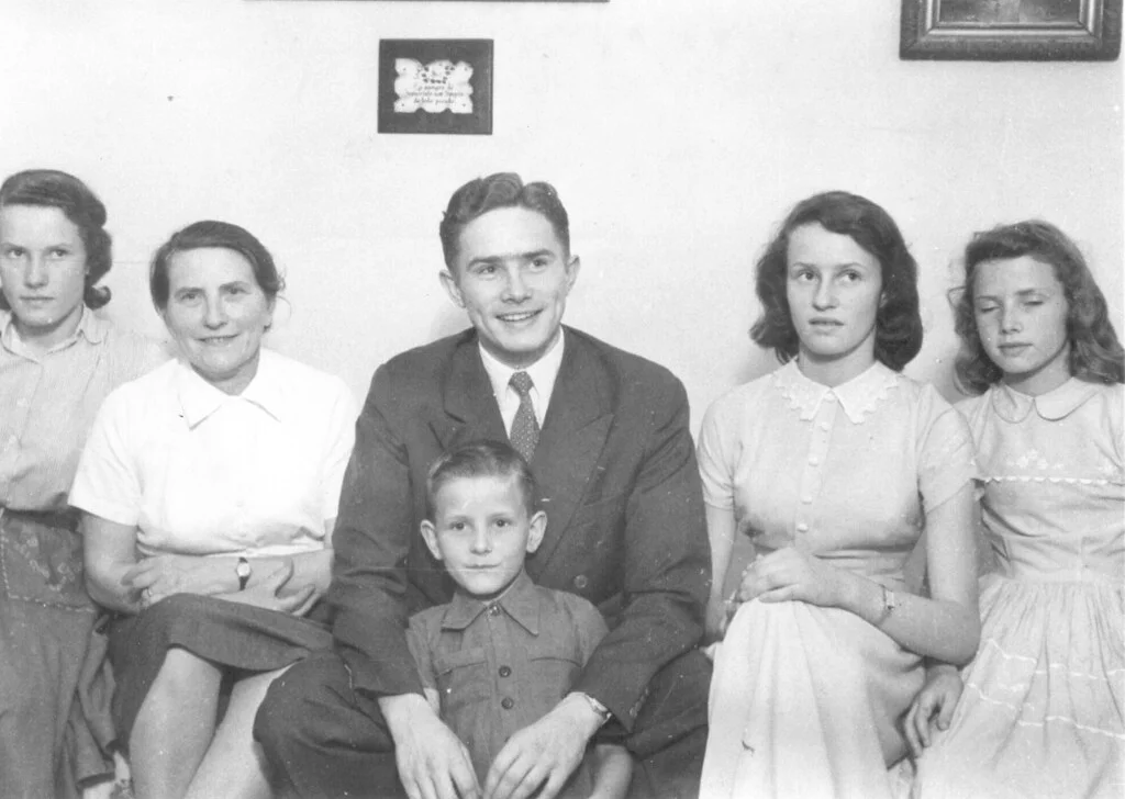Luis (center) with his mother, three of his sisters, and his little brother.