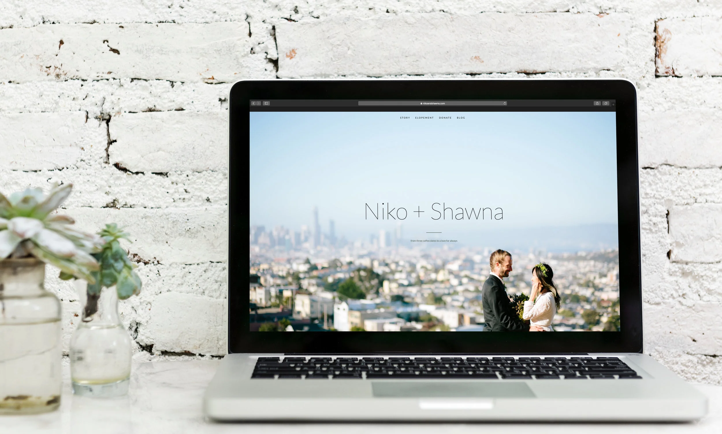 SC_Elope_Webpage_laptop_brickwall.jpg