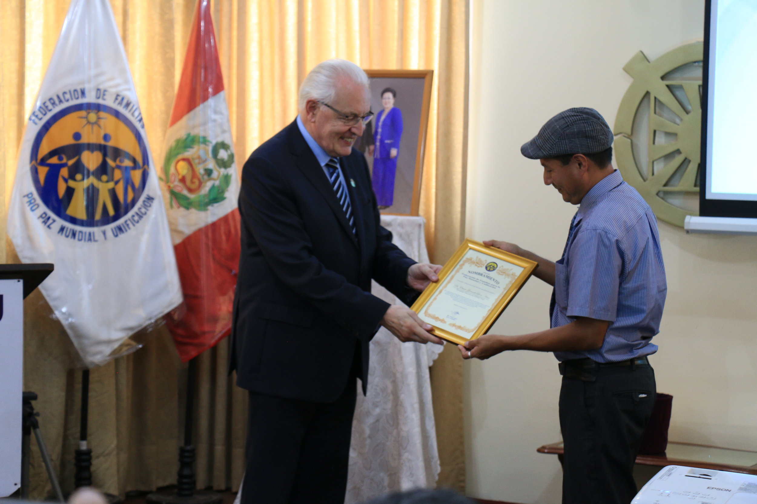 2.3 - Leadership Change, Senor Omar receiveing plaque.jpeg