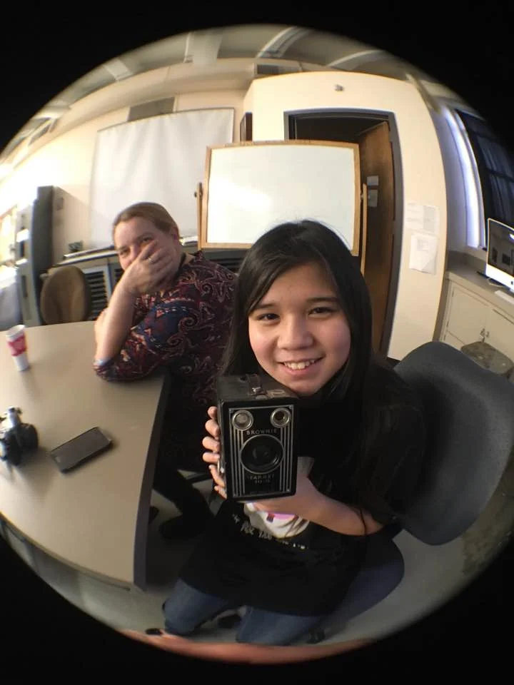 Me and my granddaughter holding my grandmother's camera the next in a tradition of women photographers in our family Photo by Wolfgang Bucher 2018