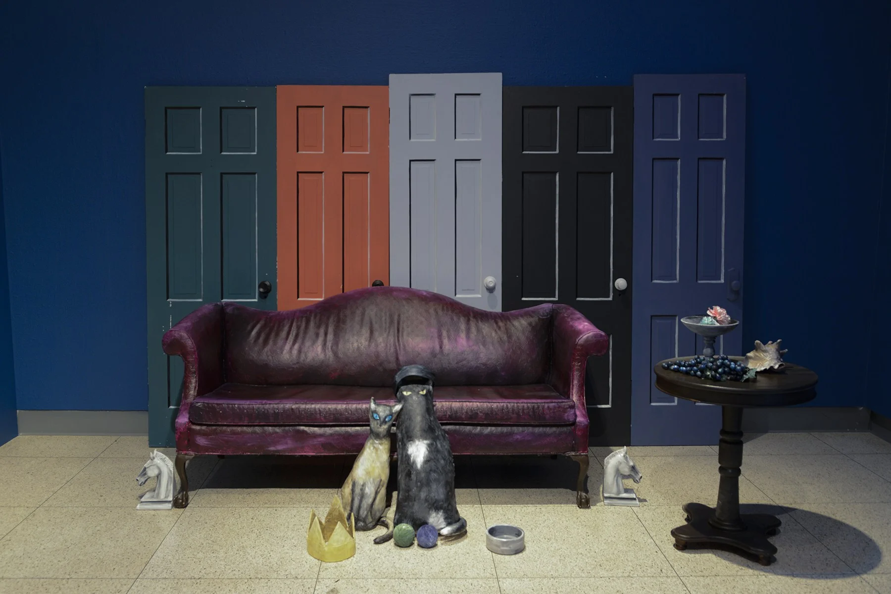 The installation by Donna Castellanos has two cats to be posed, a couch and the doors, just as they can be seen in Abercrombie’s paintings. Visitors come through to take their own pictures inside the installation as if they are within one of Abercrombie’s paintings. Image courtesy of the Illinois State Museum.