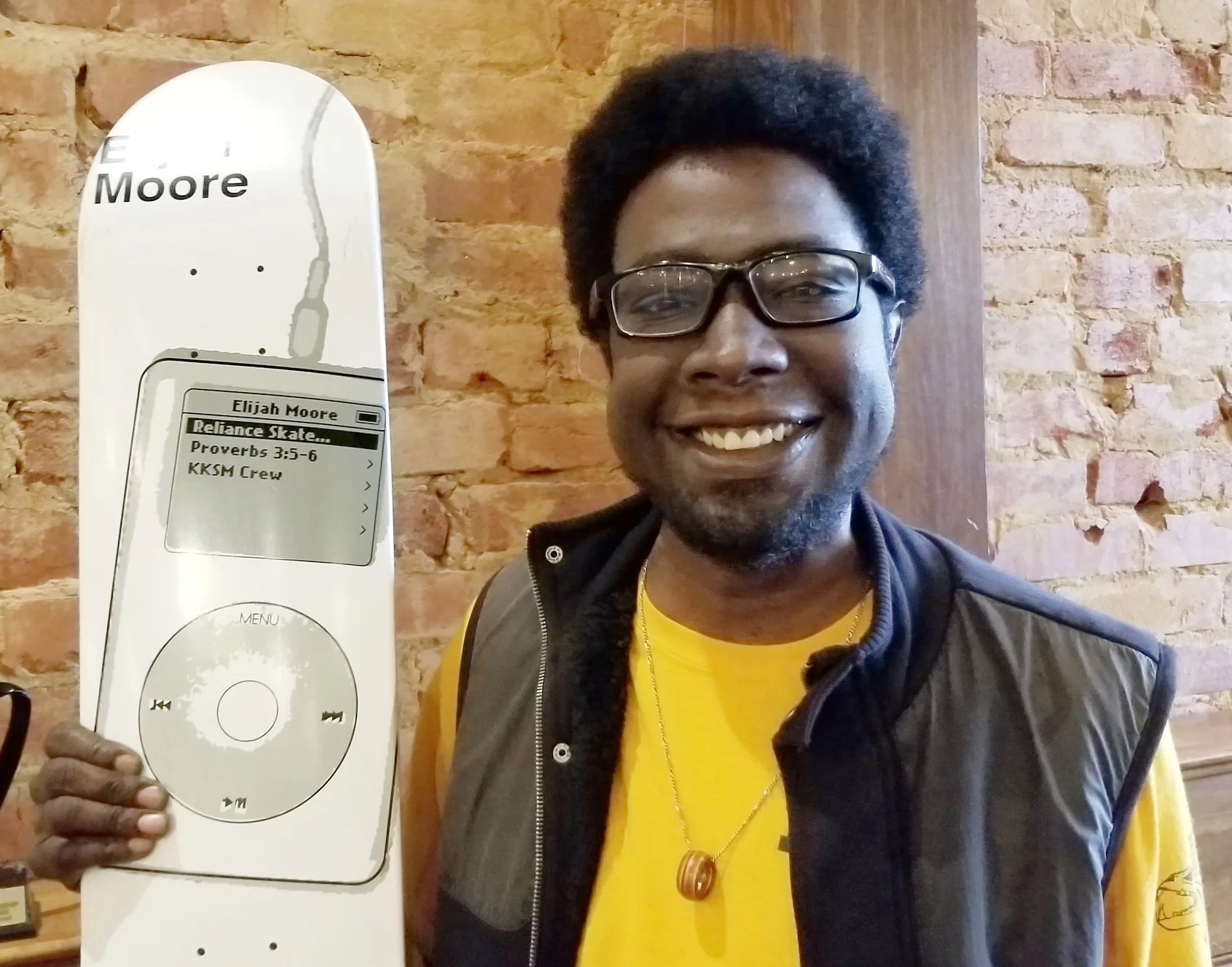 Elijah with his 2nd pro-model skateboard, featuring an original iPod