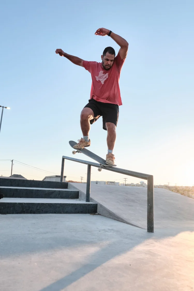 Jared grinding a rail at golden hour