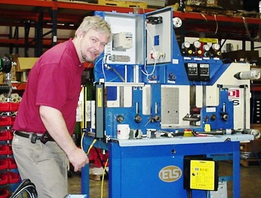 Bak refitting the controls of a high speed rotary press in 1997