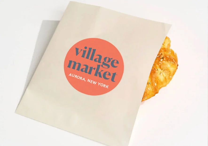 AUR-2118_VillageMarket_Logo_Rendering_PastrySleeve.jpg