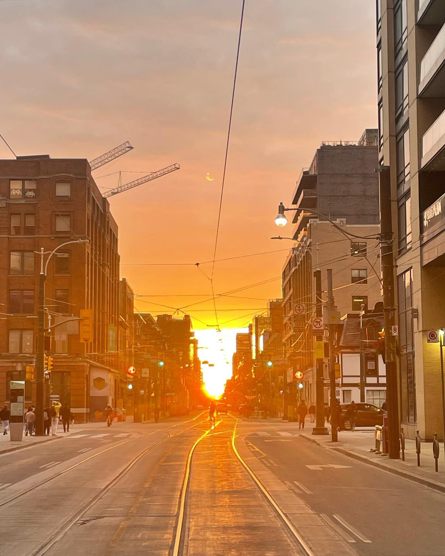 I almost got hit by a car, a bus, and a streetcar, but i think these shots of last week&rsquo;s #torontohenge are worth the risk. #toronto #sunset