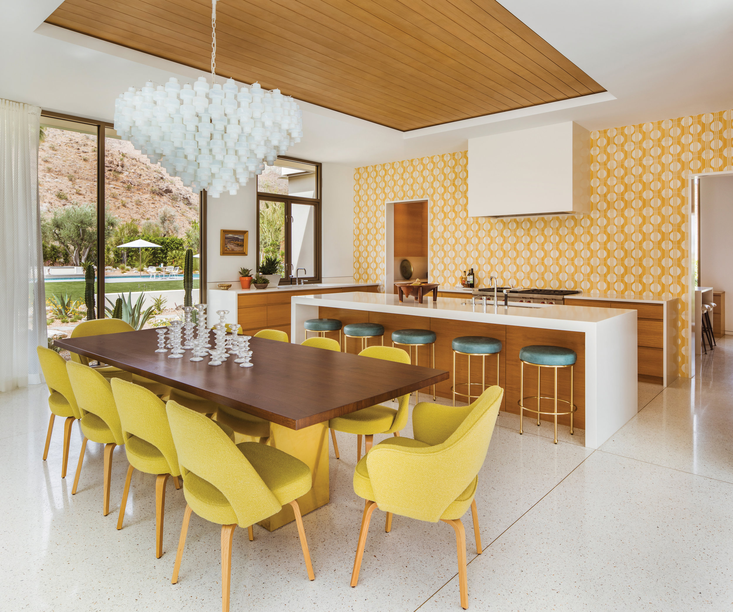  "Inside the front door, Nesen, working with her associate and lead designer Morgan Thomas and her former associate Lucy Roland, ramped up the color factor with furnishings and finishes. Perhaps most striking is a kitchen wall tiled in a hue called y