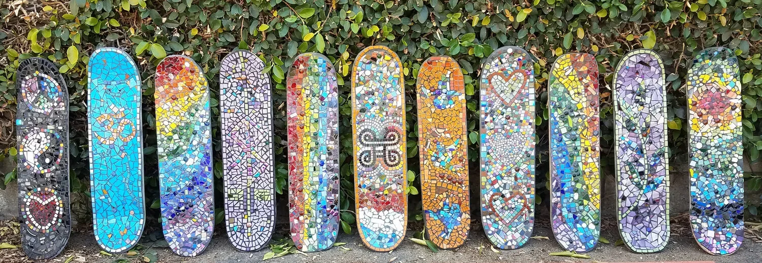 Mosaic skateboards made by the community - see them on display at the blackbird cafe on orange and wardlow ave!