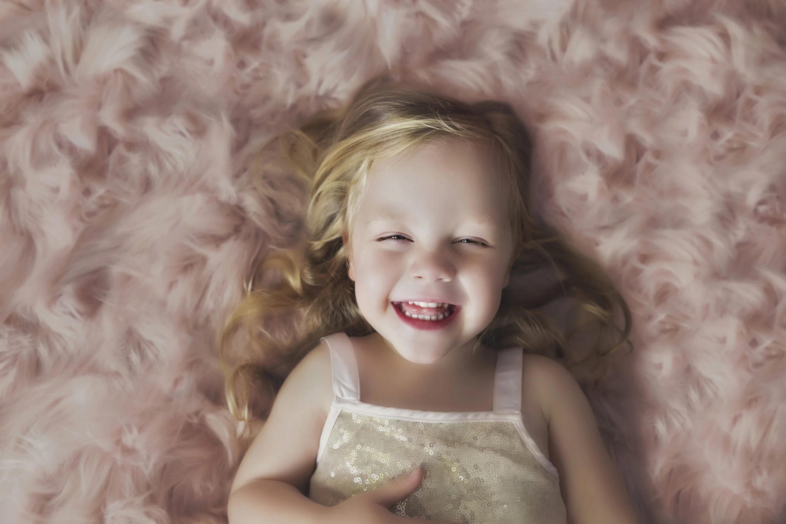 super cute baby on pink fluffy back ground by Liquid Light milestone photographer