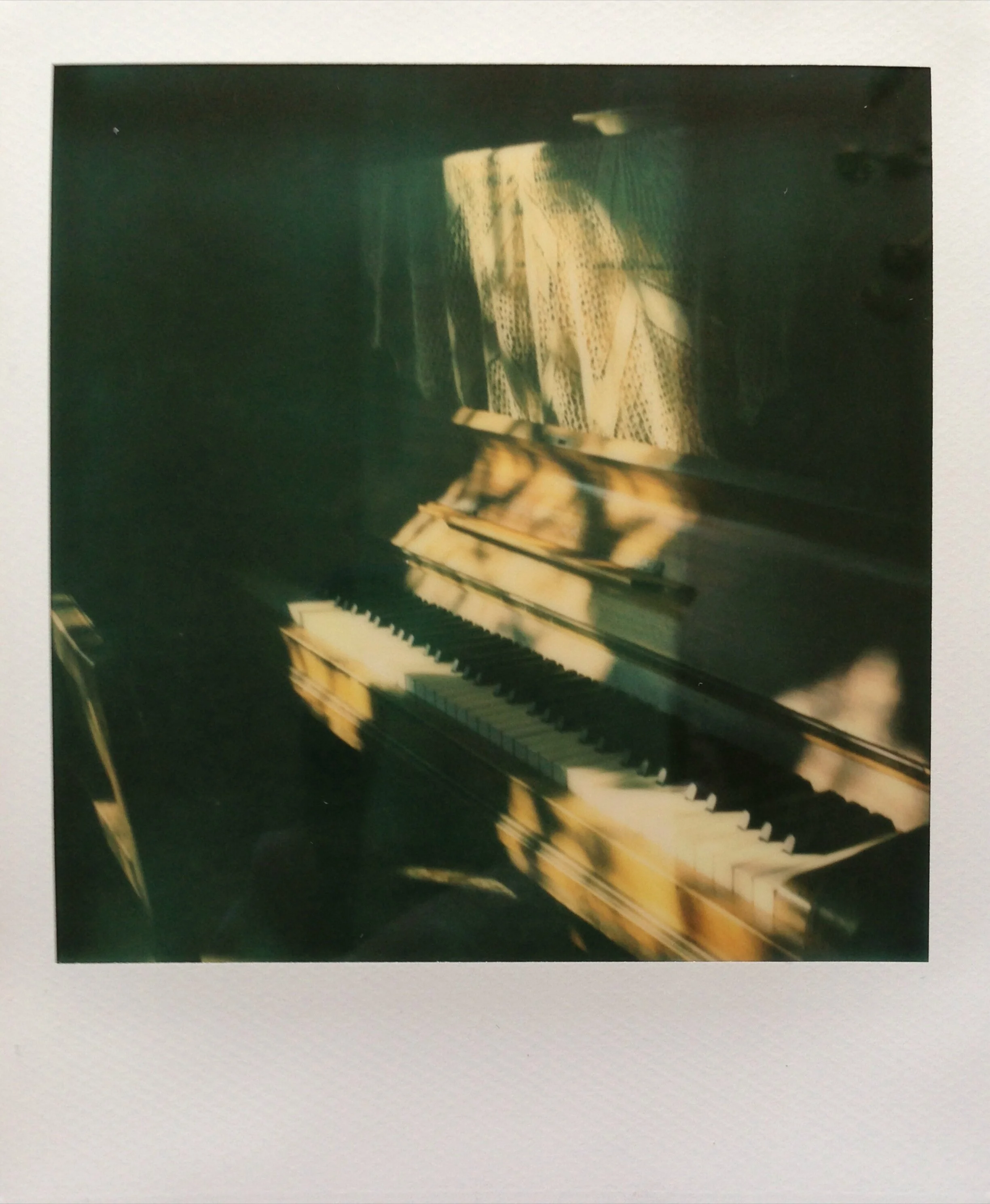 enticing light on the piano.jpeg