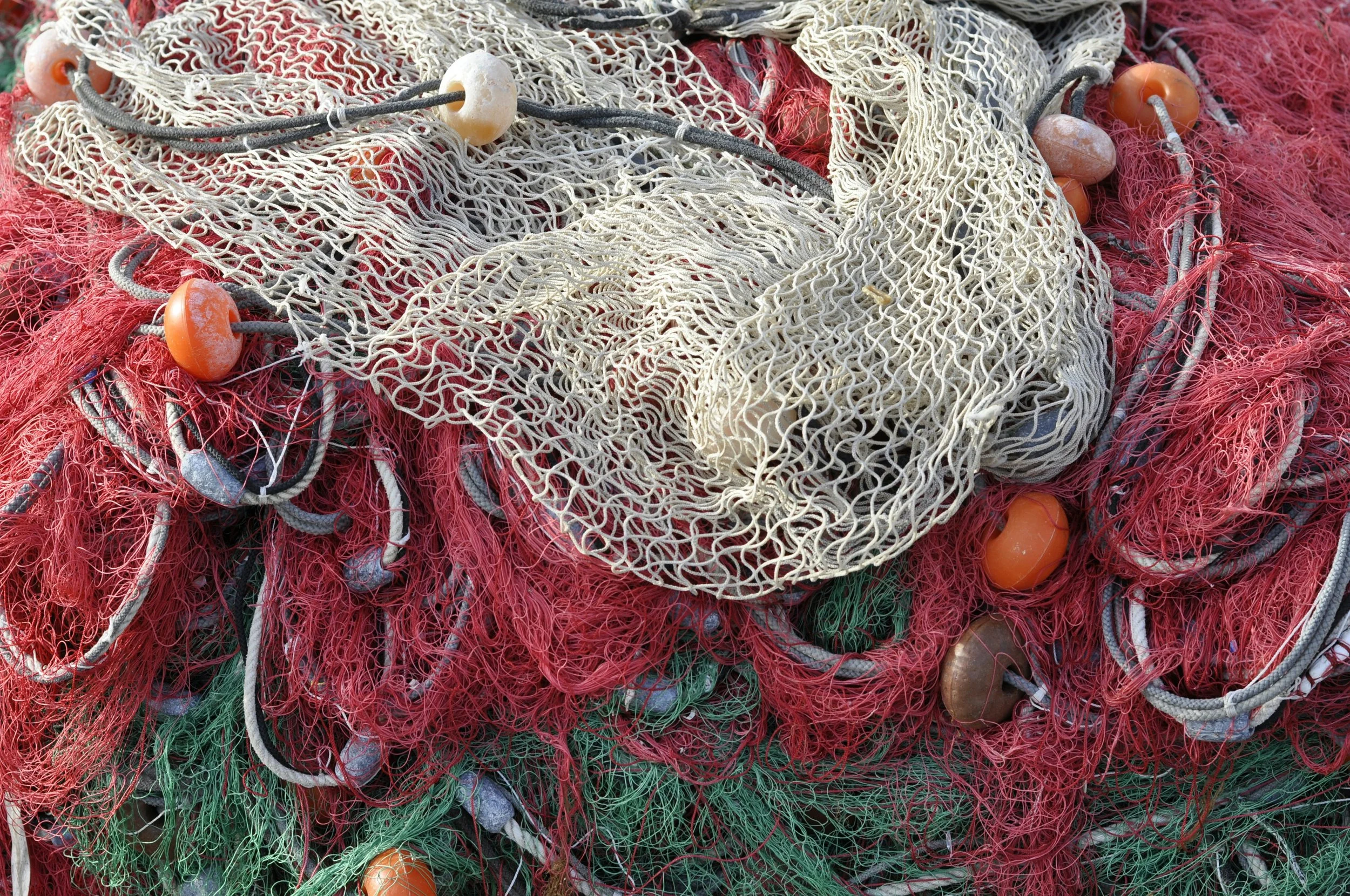 Fishing netting and buoys in a pile